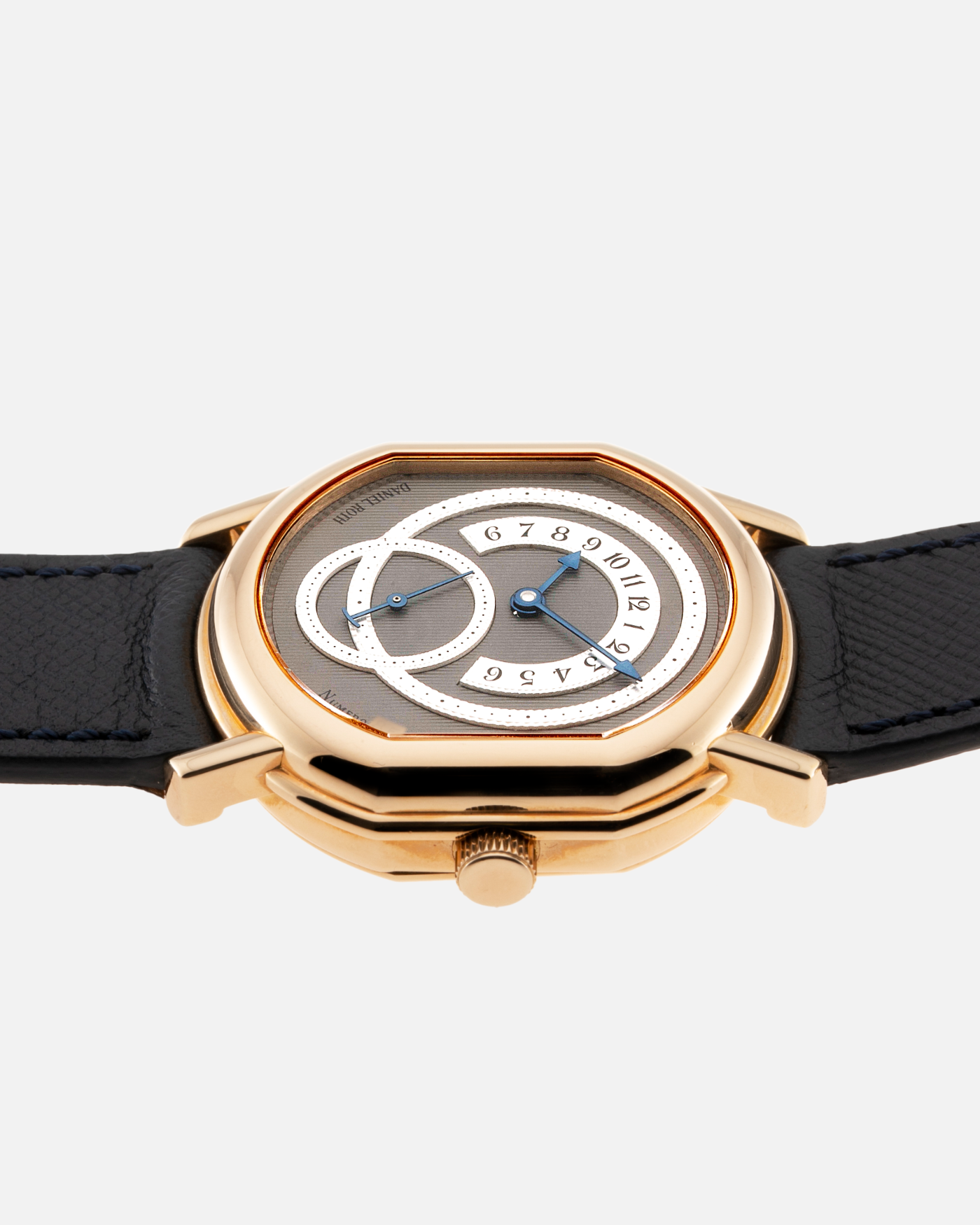 Brand: Daniel Roth Year: 1990’s Model: C127 Material: 18k Yellow Gold Movement: Lemania 27LN with Retrograde Function Case Diameter: 35mm X 38mm Strap: Molequin Navy Blue Textured Calf Strap and 18k Yellow Gold Daniel Roth Tang Buckle
