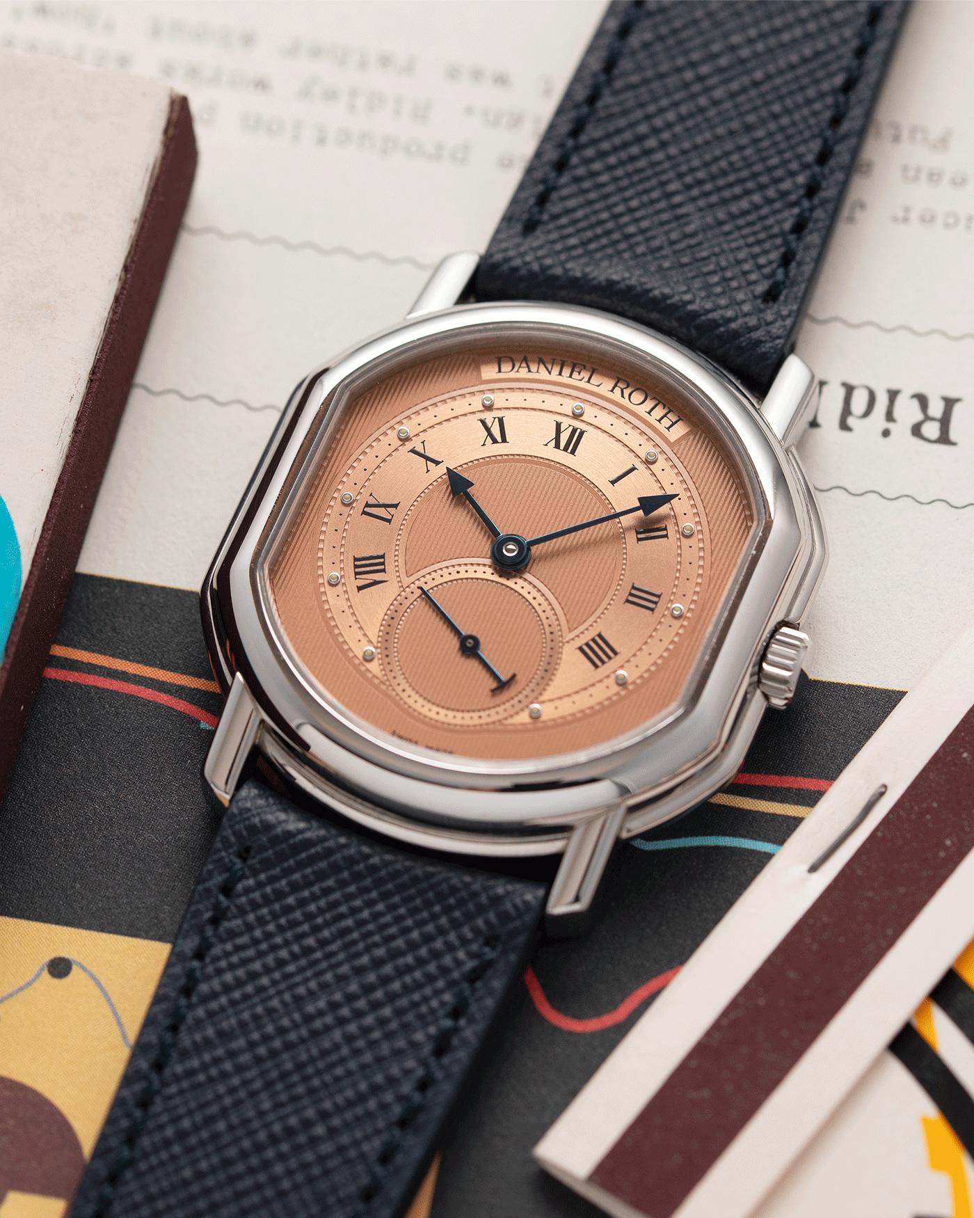 Brand: Daniel Roth Year: 1990’s Model: Small Seconds Material: Stainless Steel Case Diameter: 35mmX38mm Bracelet/Strap: Navy Blue Molequin Textured Calf and Stainless Steel Daniel Roth Tang Buckle