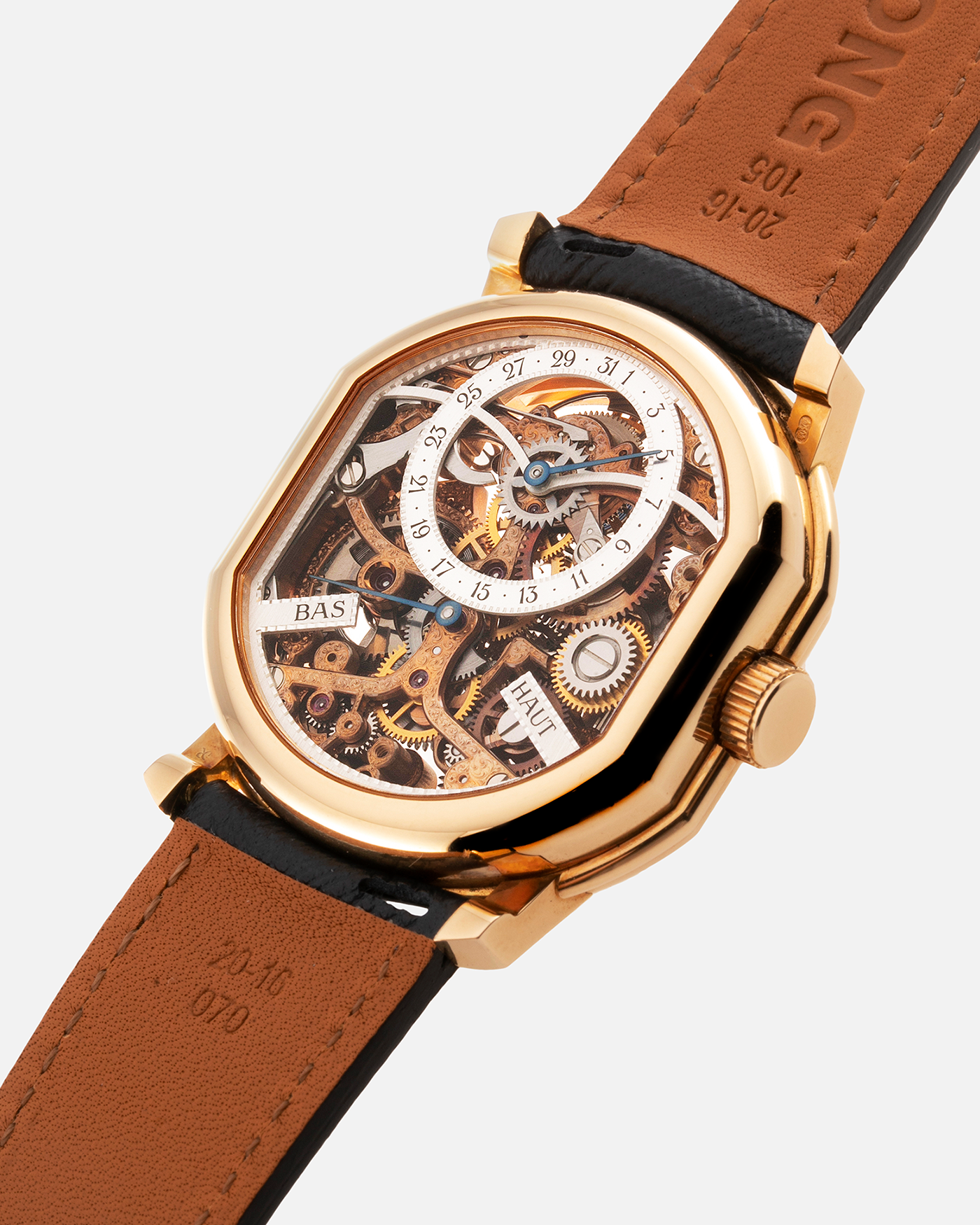 Brand: Daniel Roth Year: 1990’s Model: 2187 Material: 18k Yellow Gold Movement: Cal. DR 307 One-Minute Tourbillon Regulator Case Diameter: 35mm X 38mm Strap: Molequin Navy Blue Textured Calf and18k Yellow Gold Tang Buckle