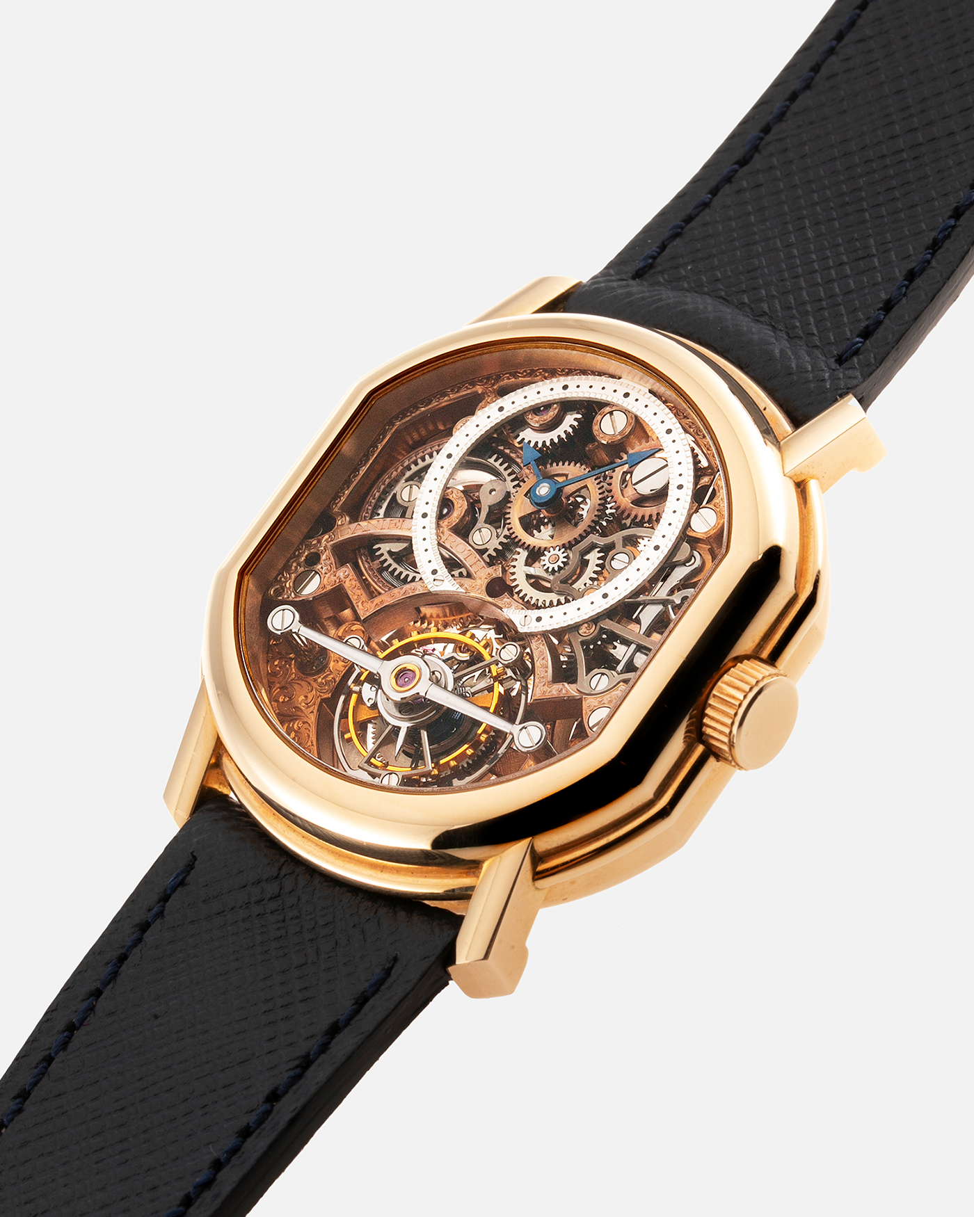 Brand: Daniel Roth Year: 1990’s Model: 2187 Material: 18k Yellow Gold Movement: Cal. DR 307 One-Minute Tourbillon Regulator Case Diameter: 35mm X 38mm Strap: Molequin Navy Blue Textured Calf and18k Yellow Gold Tang Buckle