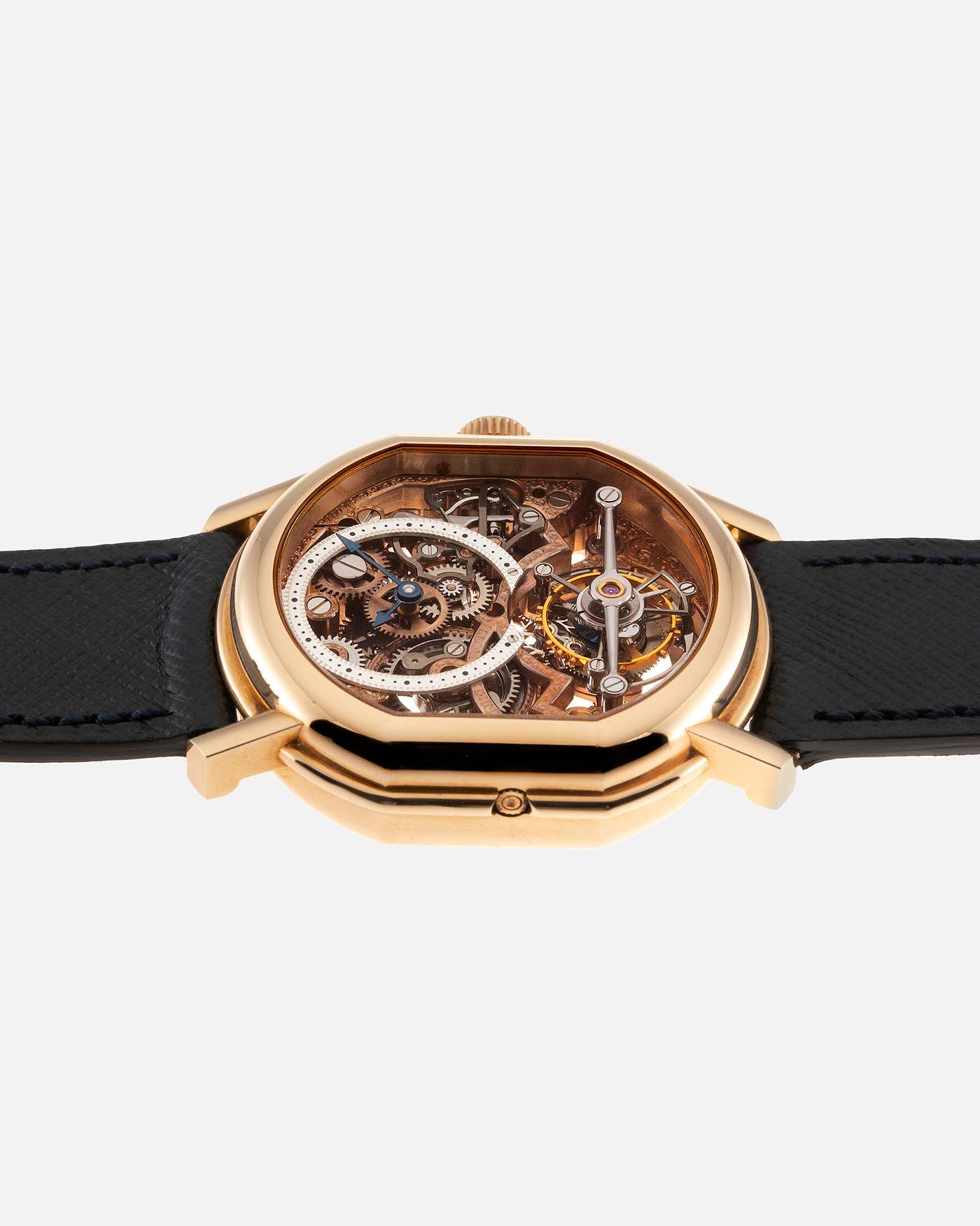 Brand: Daniel Roth Year: 1990’s Model: 2187 Material: 18k Yellow Gold Movement: Cal. DR 307 One-Minute Tourbillon Regulator Case Diameter: 35mm X 38mm Strap: Molequin Navy Blue Textured Calf and18k Yellow Gold Tang Buckle