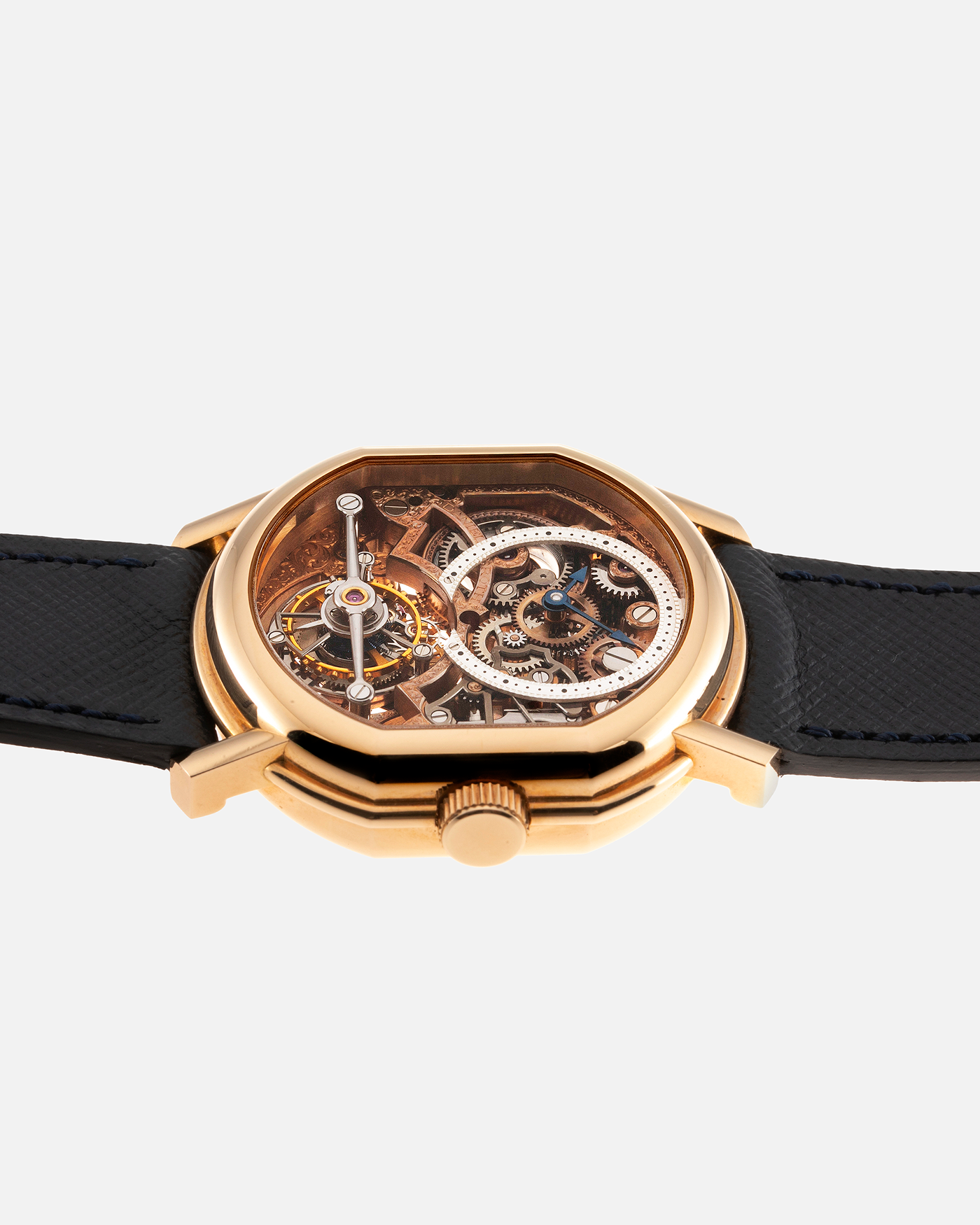 Brand: Daniel Roth Year: 1990’s Model: 2187 Material: 18k Yellow Gold Movement: Cal. DR 307 One-Minute Tourbillon Regulator Case Diameter: 35mm X 38mm Strap: Molequin Navy Blue Textured Calf and18k Yellow Gold Tang Buckle