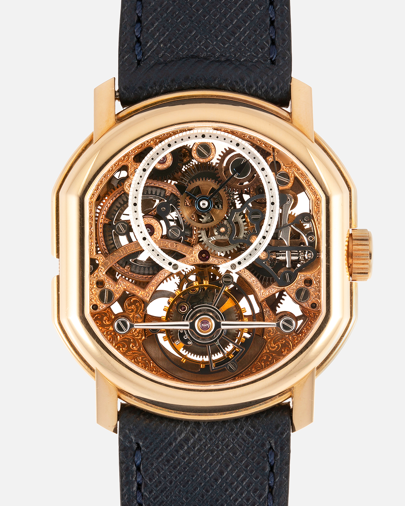 Brand: Daniel Roth Year: 1990’s Model: 2187 Material: 18k Yellow Gold Movement: Cal. DR 307 One-Minute Tourbillon Regulator Case Diameter: 35mm X 38mm Strap: Molequin Navy Blue Textured Calf and18k Yellow Gold Tang Buckle