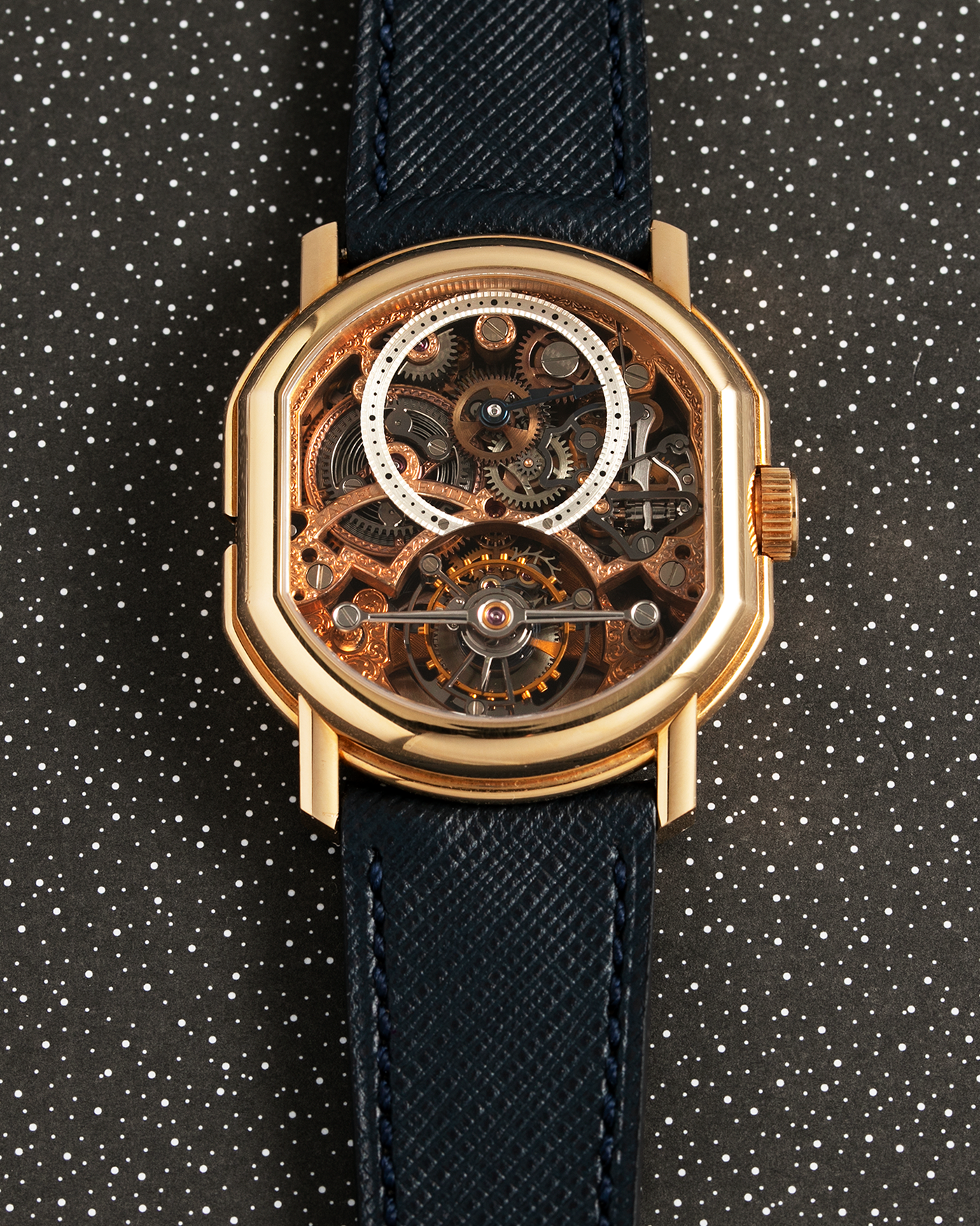 Brand: Daniel Roth Year: 1990’s Model: 2187 Material: 18k Yellow Gold Movement: Cal. DR 307 One-Minute Tourbillon Regulator Case Diameter: 35mm X 38mm Strap: Molequin Navy Blue Textured Calf and18k Yellow Gold Tang Buckle