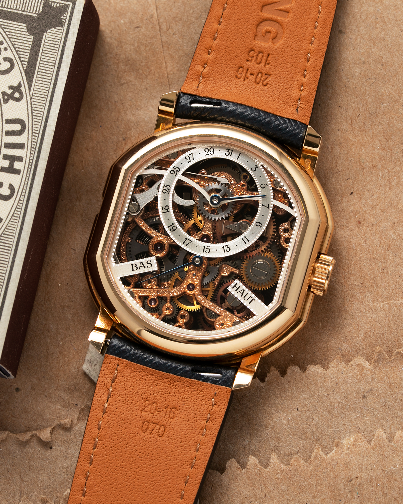 Brand: Daniel Roth Year: 1990’s Model: 2187 Material: 18k Yellow Gold Movement: Cal. DR 307 One-Minute Tourbillon Regulator Case Diameter: 35mm X 38mm Strap: Molequin Navy Blue Textured Calf and18k Yellow Gold Tang Buckle