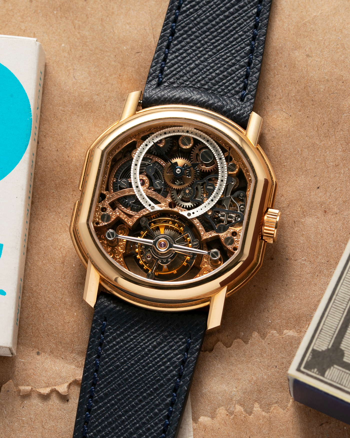 Brand: Daniel Roth Year: 1990’s Model: 2187 Material: 18k Yellow Gold Movement: Cal. DR 307 One-Minute Tourbillon Regulator Case Diameter: 35mm X 38mm Strap: Molequin Navy Blue Textured Calf and18k Yellow Gold Tang Buckle