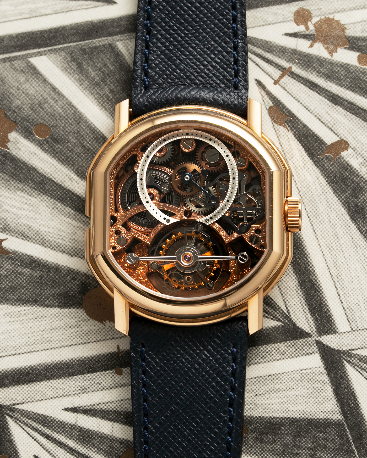 Brand: Daniel Roth Year: 1990’s Model: 2187 Material: 18k Yellow Gold Movement: Cal. DR 307 One-Minute Tourbillon Regulator Case Diameter: 35mm X 38mm Strap: Molequin Navy Blue Textured Calf and18k Yellow Gold Tang Buckle