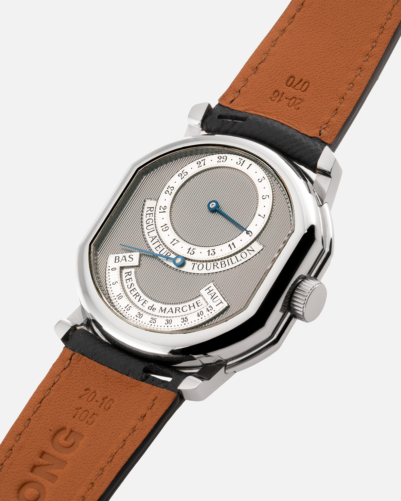 Brand: Daniel Roth Year: 1990’s Model: 2187 Material: Stainless Steel Movement: Cal. DR 307 One-Minute Tourbillon Regulator Case Diameter: 35mm X 38mm Strap: Molequin Navy Blue Textured Calf and Stainless Steel Deployant Clasp