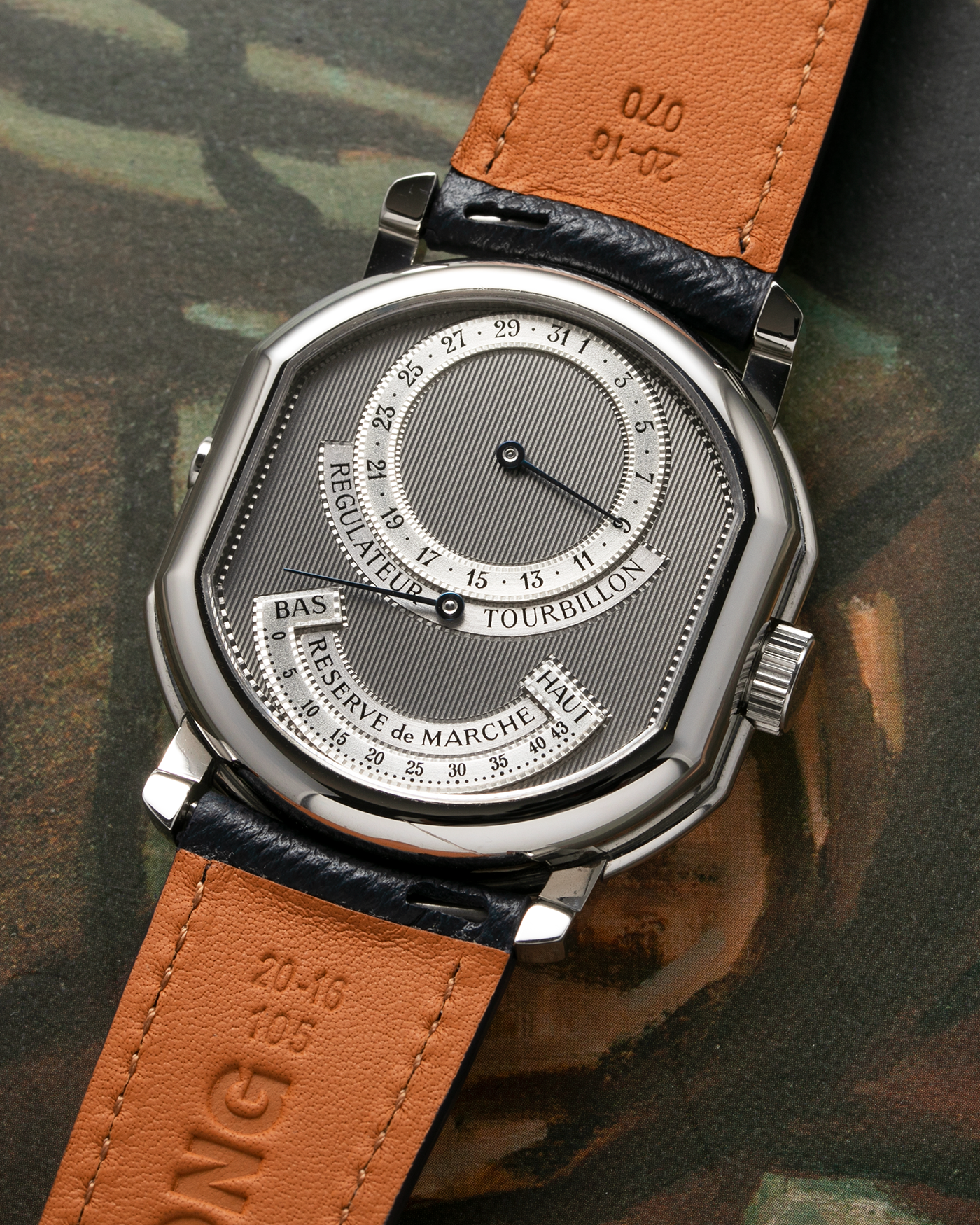 Brand: Daniel Roth Year: 1990’s Model: 2187 Material: Stainless Steel Movement: Cal. DR 307 One-Minute Tourbillon Regulator Case Diameter: 35mm X 38mm Strap: Molequin Navy Blue Textured Calf and Stainless Steel Deployant Clasp