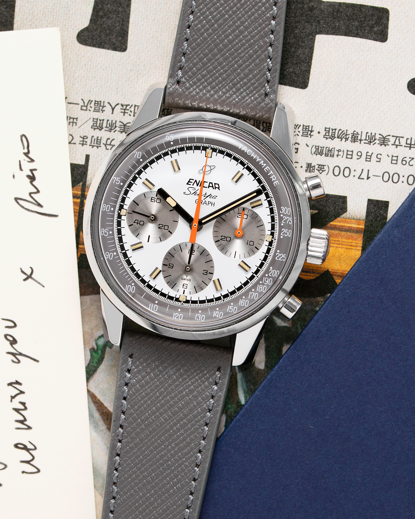 Brand: Enicar Year: 1960s Model: Sherpa Graph Material: Stainless Steel Movement: Valjoux 72 Case Diameter: 40mm Lug Width: 20mm Bracelet/Strap: Grey Molequin Textured Calf Strap