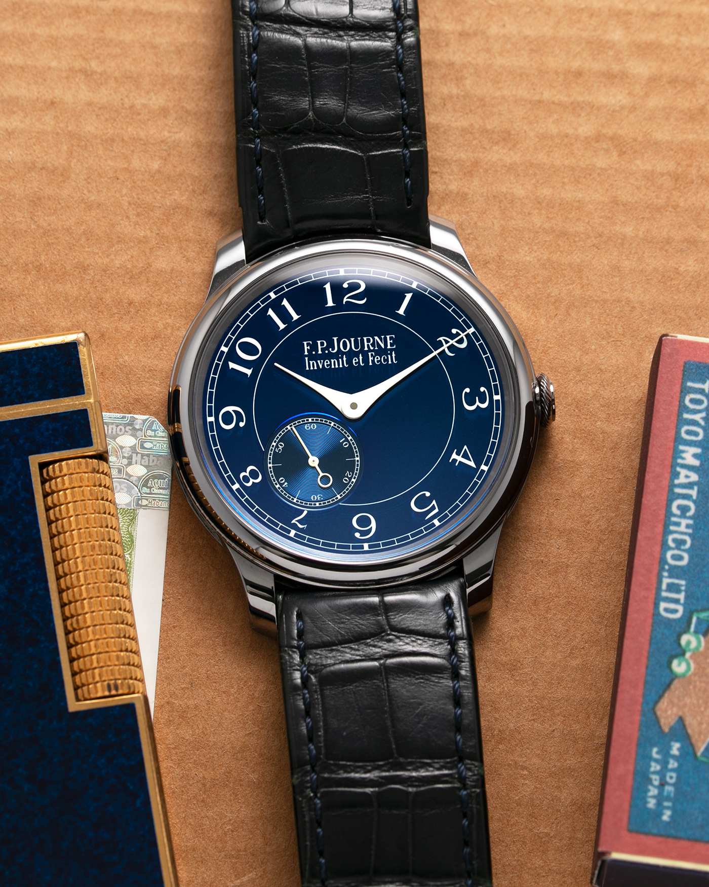 Brand: F.P. Journe Year: 2016 Model: Chronometre Bleu Material: Tantalum Movement: in-house FPJ caliber 1304 Case Diameter: 39mm Bracelet/Strap: F.P. Journe Blue Alligator and Tantalum Tang Buckle