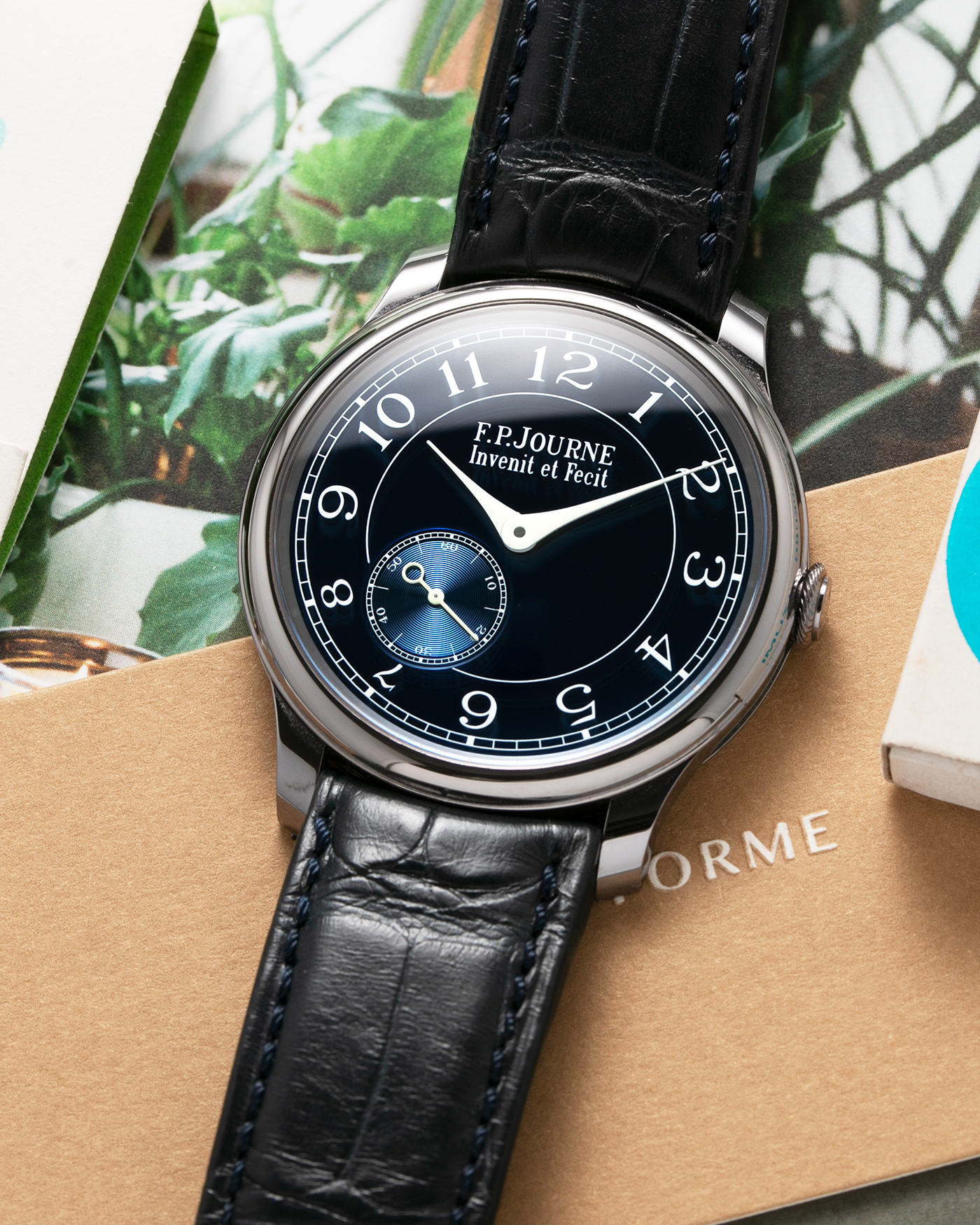 Brand: F.P. Journe Year: 2018 Model: Chronometre Bleu Material: Tantalum Movement: in-house FPJ caliber 1304 Case Diameter: 39mm Bracelet/Strap: F.P. Journe Blue Alligator and Tantalum Tang Buckle