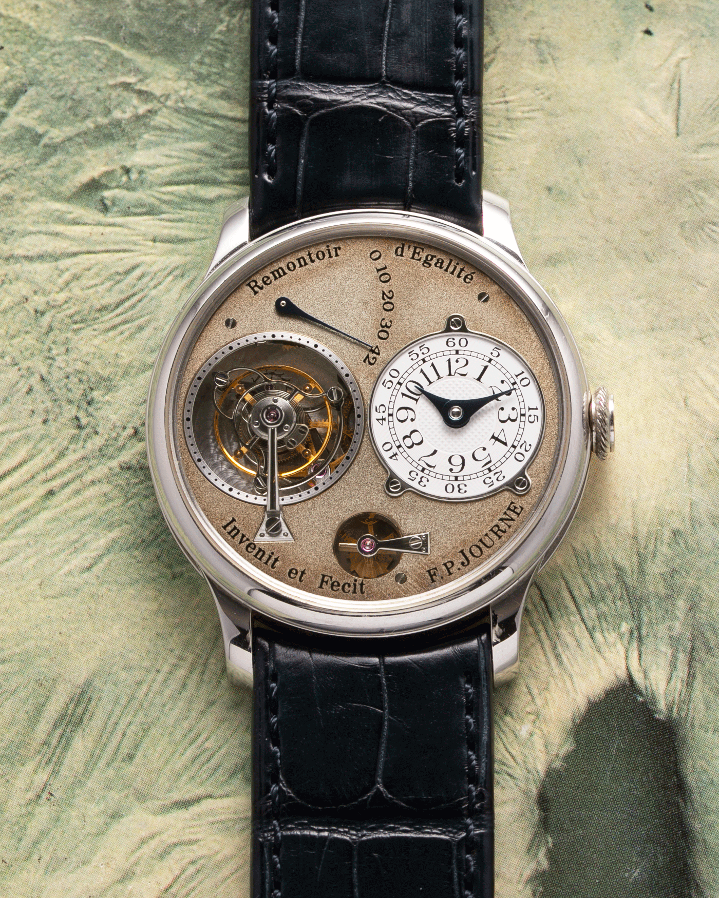 Brand: F.P. Journe Year: 2003 Model: Tourbillon Souverain Material: Platinum Movement: FPJ Caliber 1498 (One second remontoir d’egalite) Case Diameter: 38mm Bracelet/Strap: F.P. Journe Navy Blue Alligator and Platinum Signed Tang Buckle