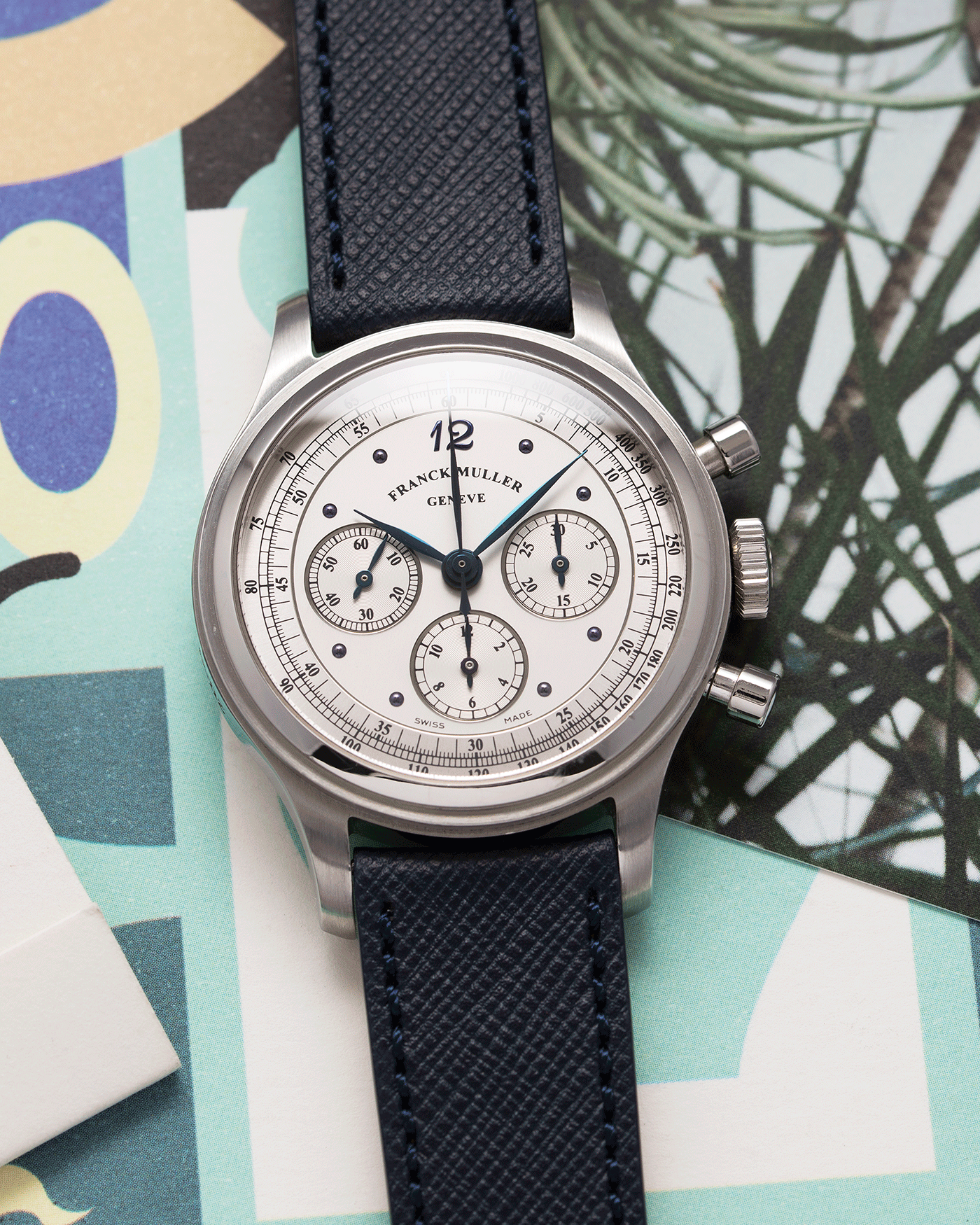Brand: Franck Muller Year: 1990’s Model: Sport Limited Edition Chronograph Mercedes Benz Material: Stainless Steel Movement: Modified Lemania Cal. 1874 Case Diameter: 37mm Strap: Navy Blue Molequin Textured Calf Strap with Franck Muller Stainless Steel Tang Buckle