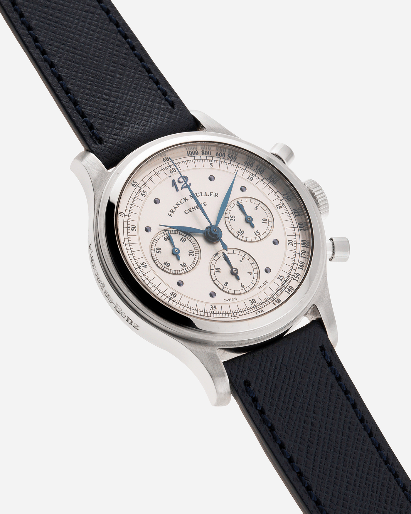 Brand: Franck Muller Year: 1990’s Model: Sport Limited Edition Chronograph Mercedes Benz Material: Stainless Steel Movement: Modified Lemania Cal. 1874 Case Diameter: 37mm Strap: Navy Blue Molequin Textured Calf Strap with Franck Muller Stainless Steel Tang Buckle
