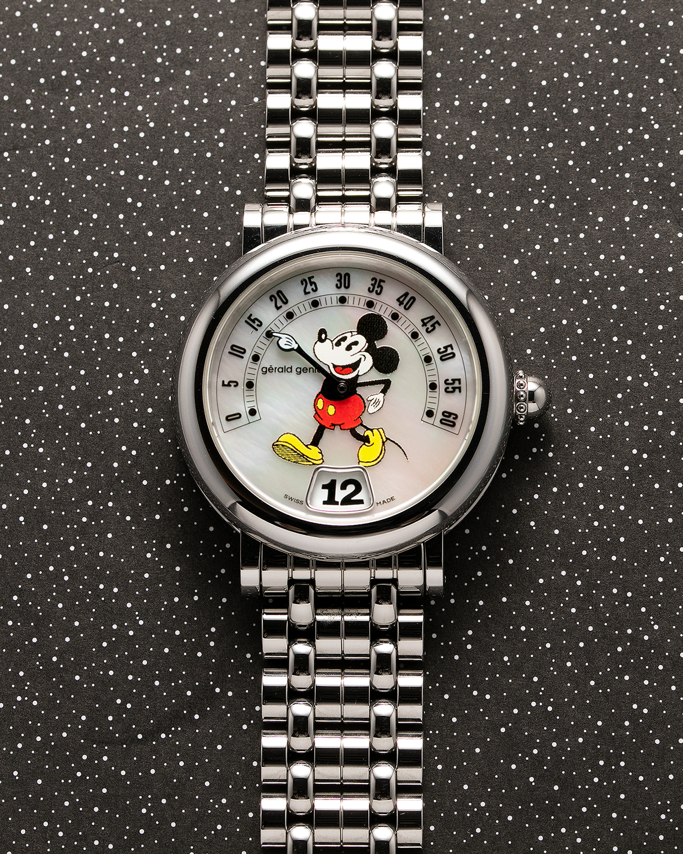 Brand: Gerald Genta Year: 1990’s Model: Ref. 3632G Retro “Mickey Mouse” Material: Stainless Steel case, Mother of Pearl dial Movement: Cal. ETA 2892A2, Self-Winding Case Diameter: 36mm Bracelet/Strap: Gerald Genta Stainless Steel Bracelet with Genta Signed Clasp