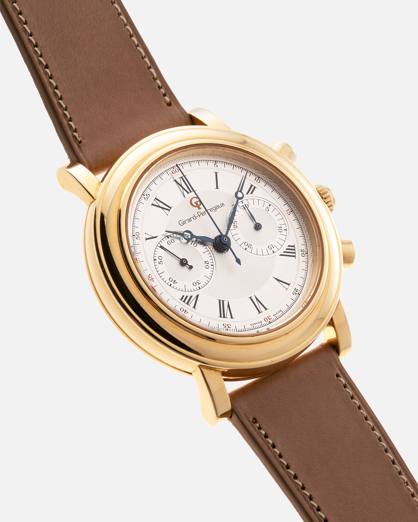 Brand: Girard Perregaux Year: 1990’s Reference Number: 47930 Material: 18k Yellow Gold Movement: Lemania Cal. 1872  Case Diameter: 38mm Strap: Nostime Tan Strap and 18k Yellow Gold Girard Perregaux Tan Buckle