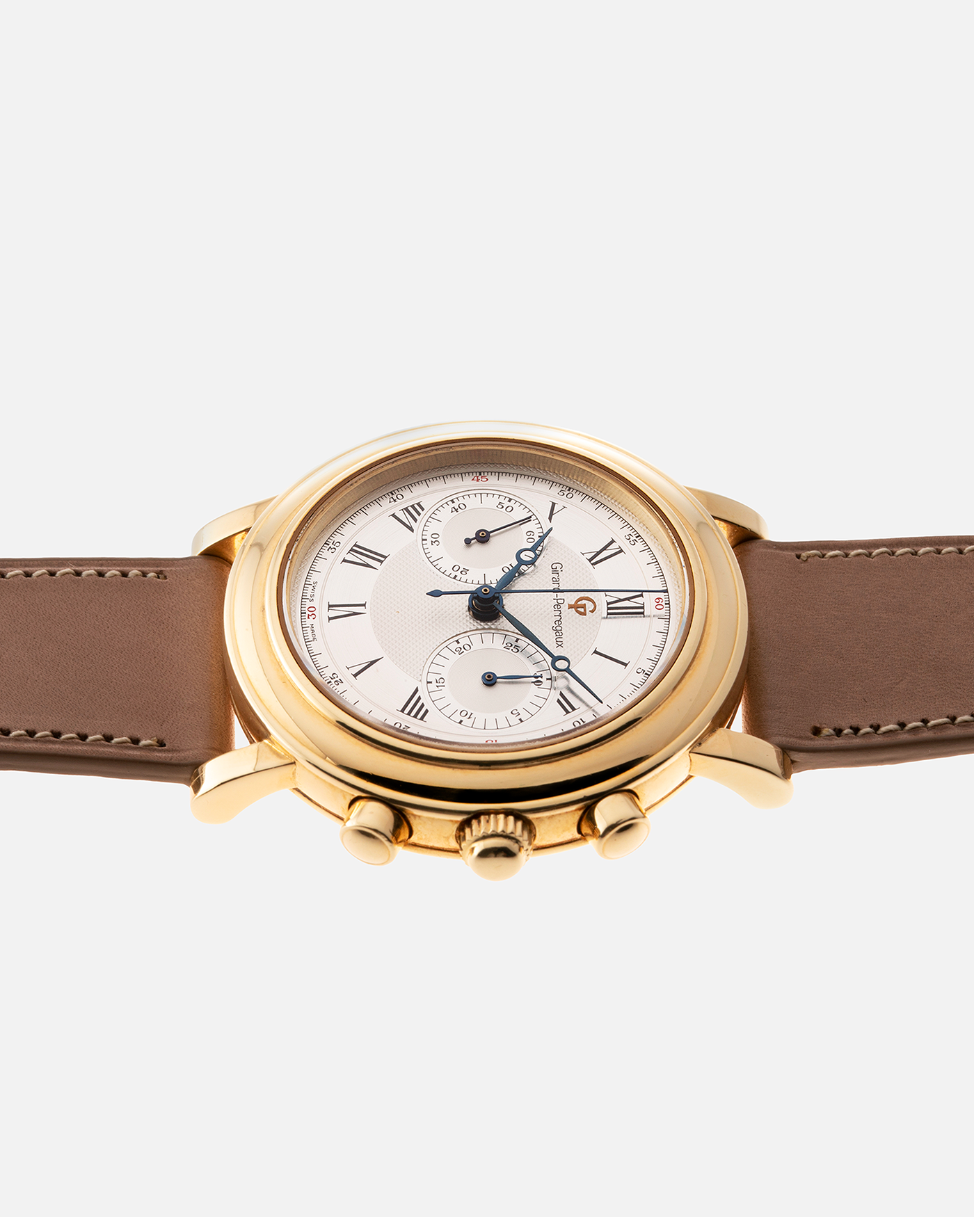 Brand: Girard Perregaux Year: 1990’s Reference Number: 47930 Material: 18k Yellow Gold Movement: Lemania Cal. 1872  Case Diameter: 38mm Strap: Nostime Tan Strap and 18k Yellow Gold Girard Perregaux Tan Buckle