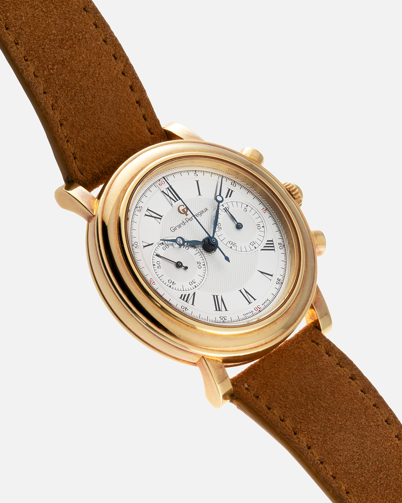 Brand: Girard Perregaux Year: 1990’s Reference Number: 47930 Material: 18k Yellow Gold Movement: Lemania Cal. 1872  Case Diameter: 38mm Strap: Tan Strap and 18k Yellow Gold Girard Perregaux Tan Buckle