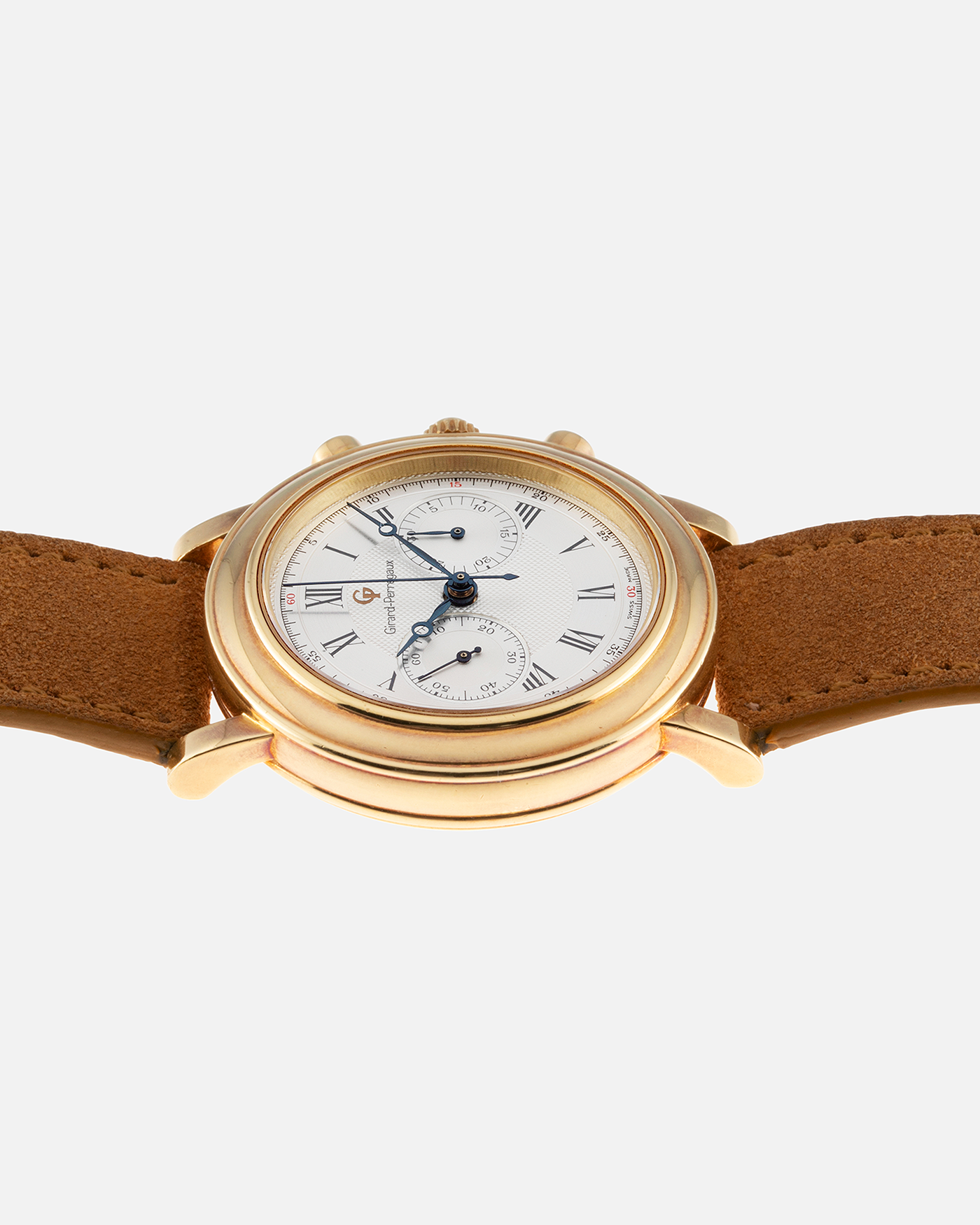 Brand: Girard Perregaux Year: 1990’s Reference Number: 47930 Material: 18k Yellow Gold Movement: Lemania Cal. 1872  Case Diameter: 38mm Strap: Tan Strap and 18k Yellow Gold Girard Perregaux Tan Buckle