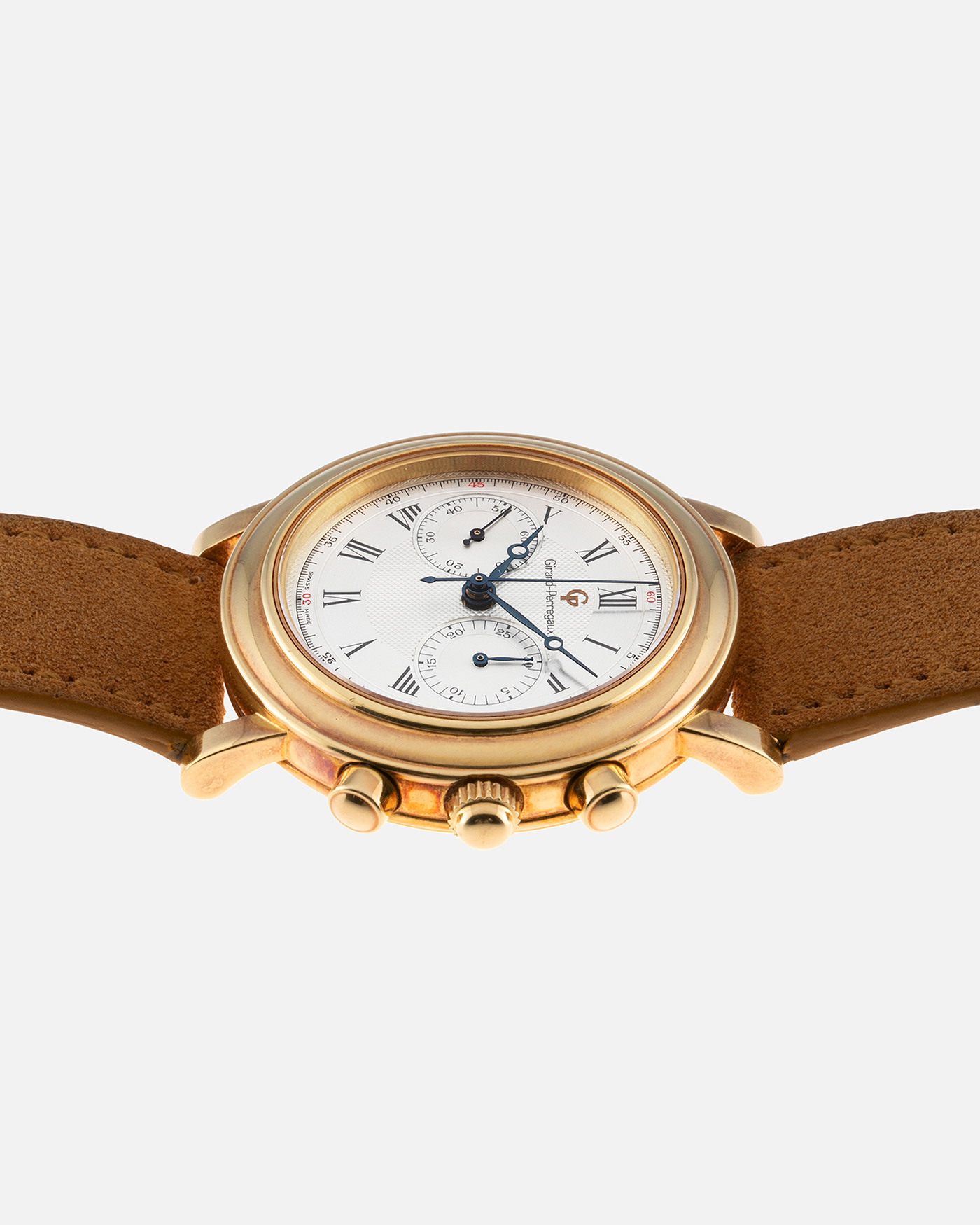 Brand: Girard Perregaux Year: 1990’s Reference Number: 47930 Material: 18k Yellow Gold Movement: Lemania Cal. 1872  Case Diameter: 38mm Strap: Tan Strap and 18k Yellow Gold Girard Perregaux Tan Buckle