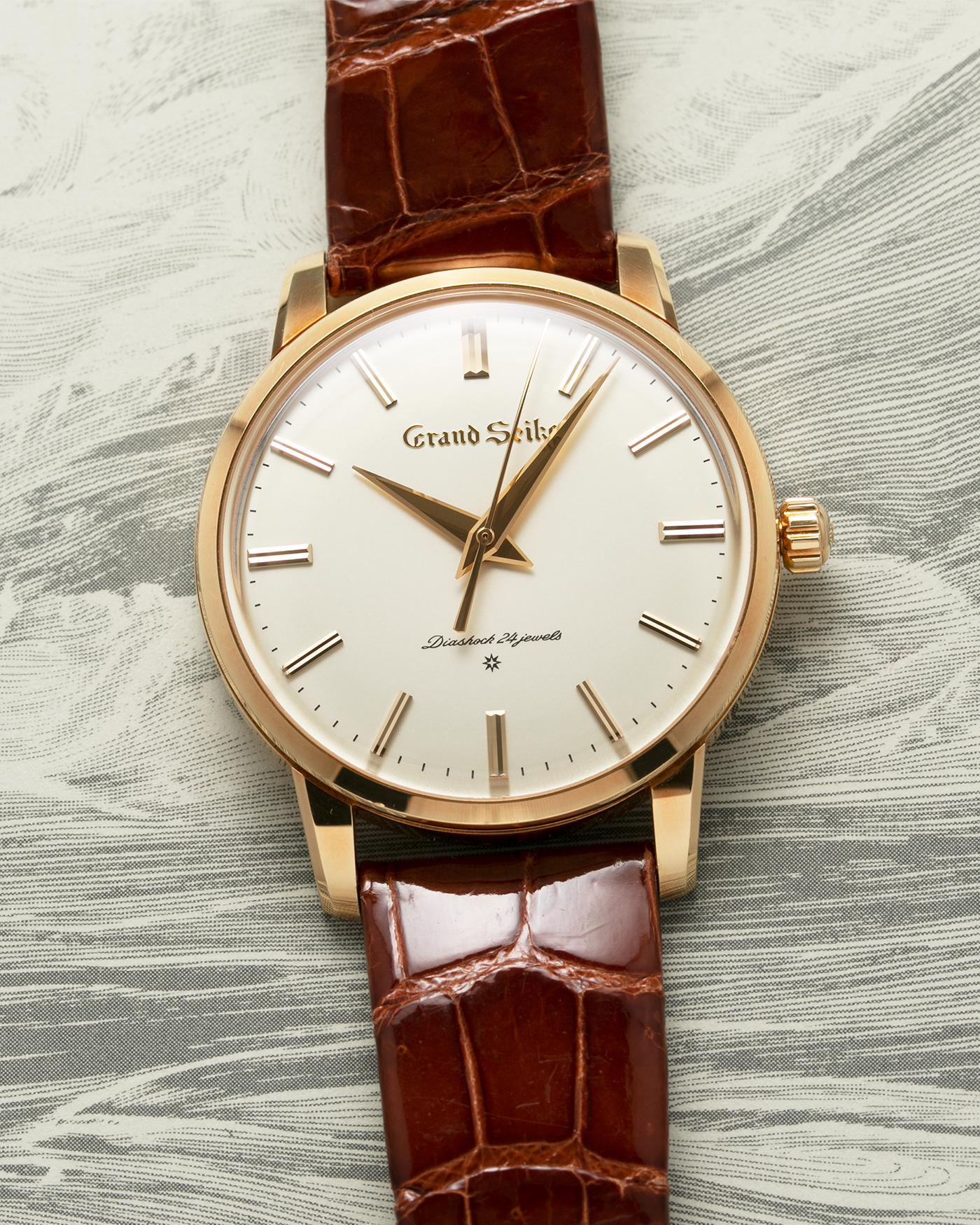 Brand: Grand Seiko Year: 2017 Model: SBGW252 Material: 18k Yellow Gold Movement: Manually wound Grand Seiko caliber 9S64 Case Diameter: 38mm Bracelet: Grand Seiko Chestnut Alligator Strap with 18k Yellow Gold Tang Buckle 