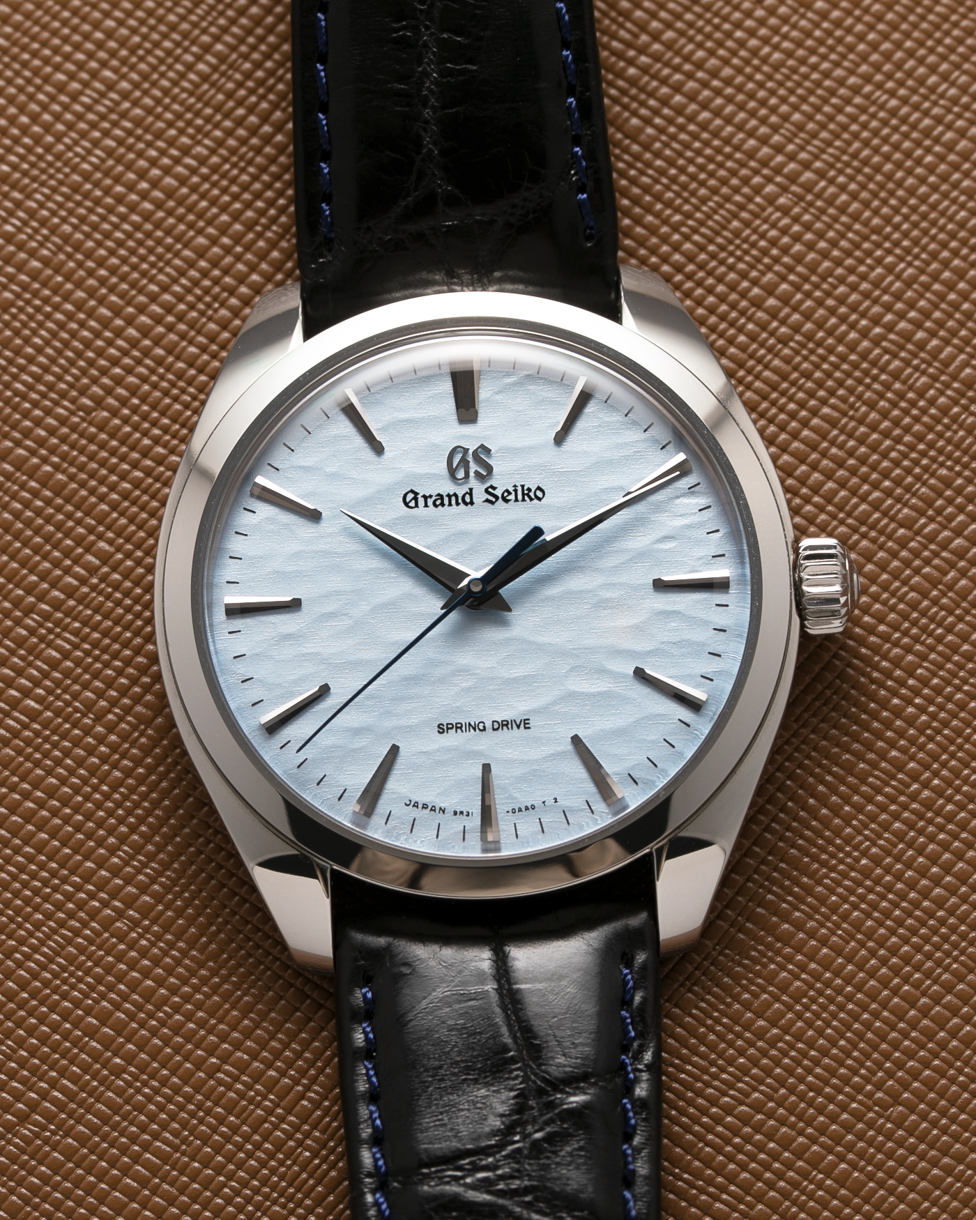 Brand: Grand Seiko Year: 2021 Reference Number: SBGY003 Spring Drive Material: Stainless Steel Movement: Cal 9R31 Case Diameter: 38.5mm Strap: Grand Seiko Black Crocodile Strap with Blue Stitching and Stainless Steel Deployant