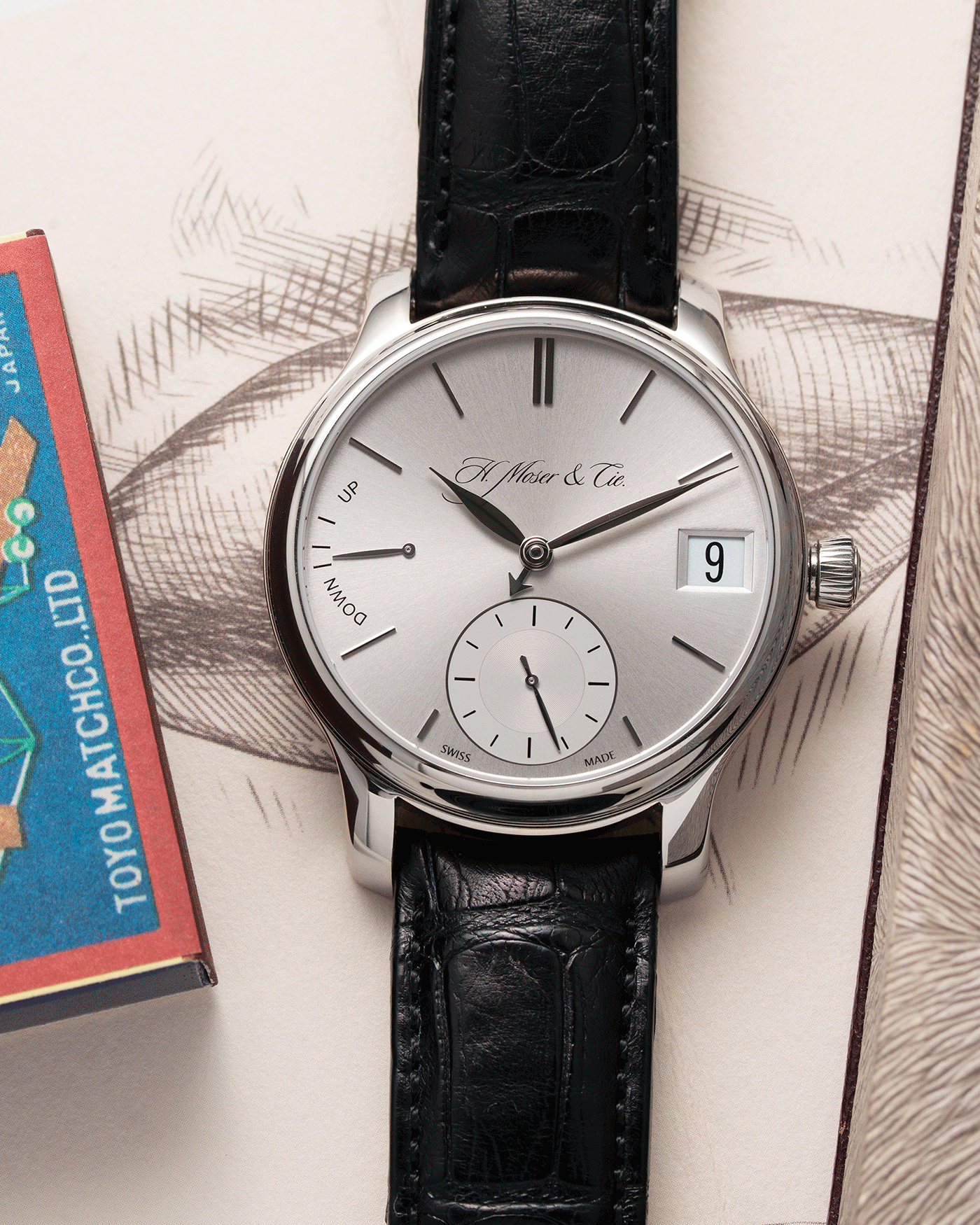Brand: H.Moser & Cie Year: 2013 Model: Endeavour Perpetual Reference Number: 341.501-002 Material: 18k White Gold Movement: Manually wound Caliber HMC 341.501 Case Diameter: 40.8mm Bracelet/Strap: H. Moser & Cie Black Alligator Leather Strap with matching 18k White Gold Tang Buckle