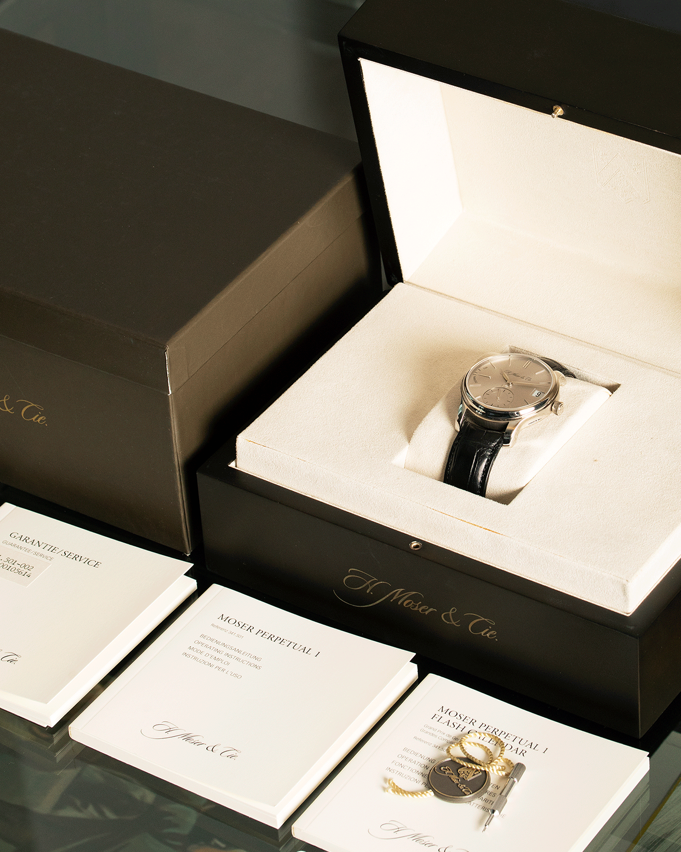 Brand: H.Moser & Cie Year: 2013 Model: Endeavour Perpetual Reference Number: 341.501-002 Material: 18k White Gold Movement: Manually wound Caliber HMC 341.501 Case Diameter: 40.8mm Bracelet/Strap: H. Moser & Cie Black Alligator Leather Strap with matching 18k White Gold Tang Buckle