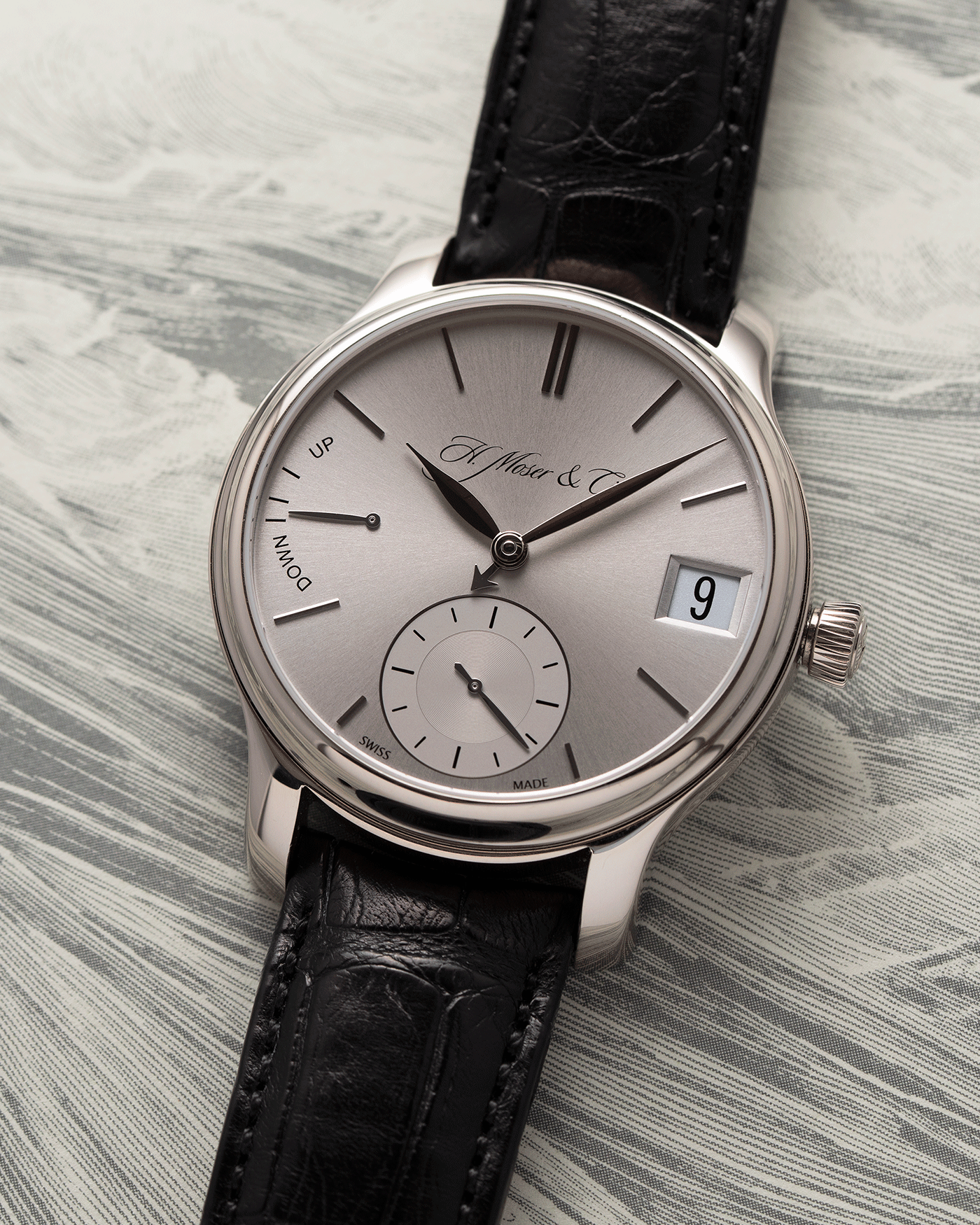 Brand: H.Moser & Cie Year: 2013 Model: Endeavour Perpetual Reference Number: 341.501-002 Material: 18k White Gold Movement: Manually wound Caliber HMC 341.501 Case Diameter: 40.8mm Bracelet/Strap: H. Moser & Cie Black Alligator Leather Strap with matching 18k White Gold Tang Buckle