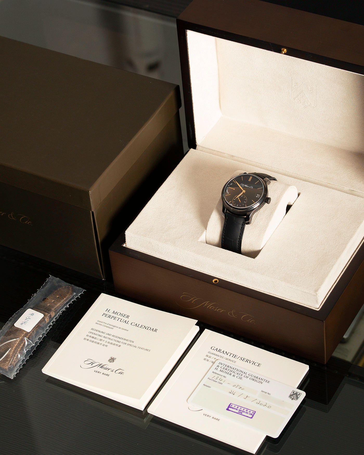 Brand: H.Moser & Cie Year: 2020 Model: Endeavour Perpetual Black Edition Reference Number: 341.050-020 Material: DLC Treated Titanium Movement: Manually wound Caliber HMC 341 Case Diameter: 40.8mm Bracelet/Strap: H. Moser & Cie Black Alligator Leather Strap with matching DLC Coated Titanium Tang Buckle