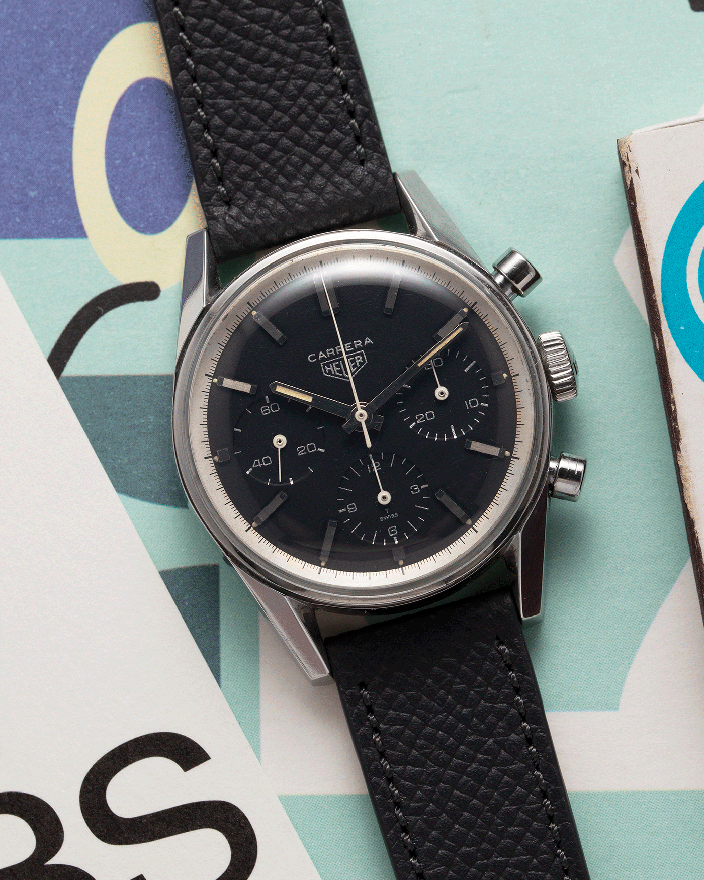Brand: Heuer Year: 1960’s Model: Carrera Reference Number: 2447N Serial Number: 78XXX Material: Stainless Steel Movement: Valjoux 72 Case Diameter: 36mm Lug Width: 18mm Bracelet/Strap: Molequin Anthracite Textured Calf with Stainless Steel Tang Buckle