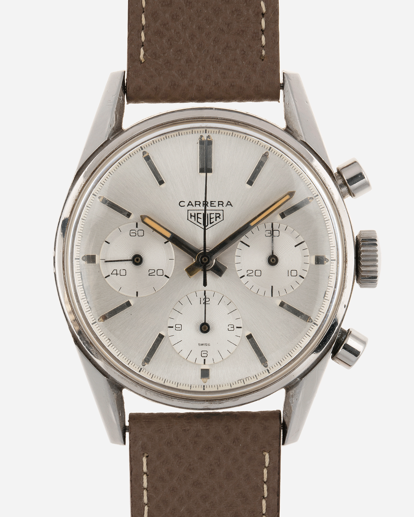 Brand: Heuer Year: 1960’s Model: Carrera Reference Number: 2447S Material: Stainless Steel Movement: Valjoux 72 Case Diameter: 36mm Lug Width: 18mm Bracelet/Strap: Nostime Grained Taupe