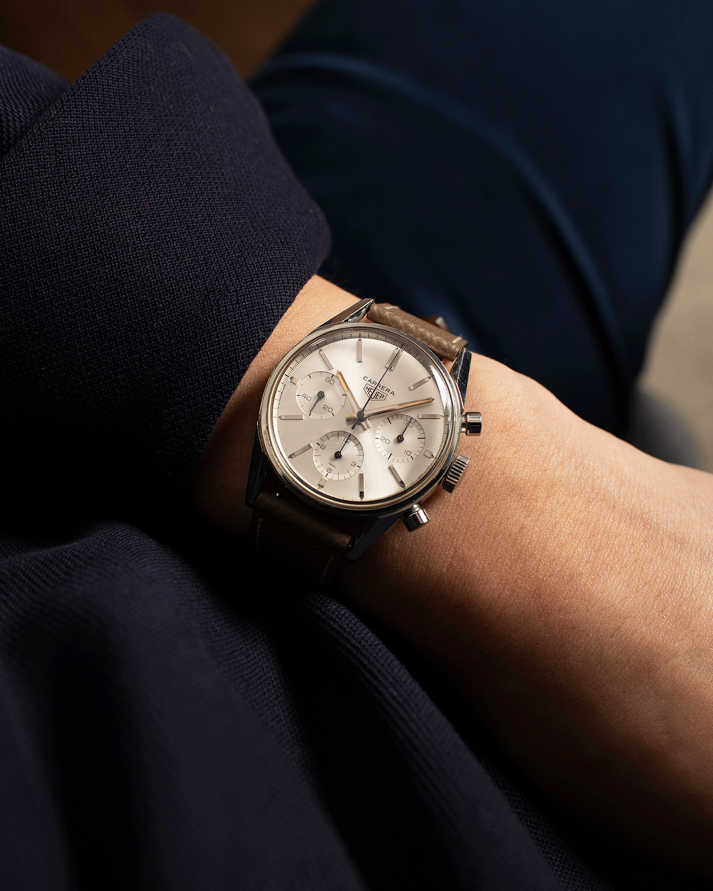 Brand: Heuer Year: 1960’s Model: Carrera Reference Number: 2447S Material: Stainless Steel Movement: Valjoux 72 Case Diameter: 36mm Lug Width: 18mm Bracelet/Strap: Nostime Grained Taupe