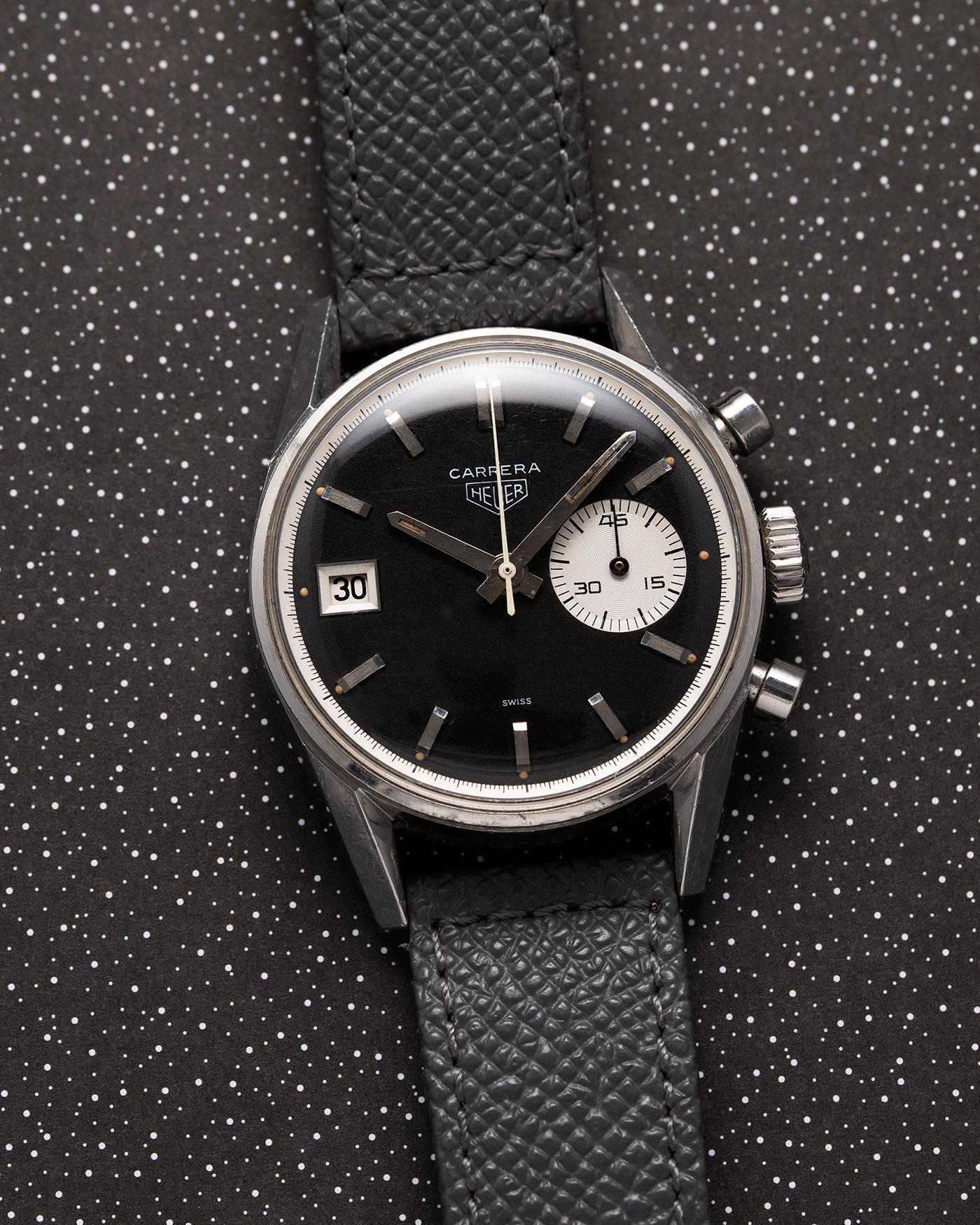 Brand: Heuer Year: 1960’s Model: Carrera Reference Number: Dato 45 Ref. 3147N Material: Stainless Steel Movement: Landeron 189 Case Diameter: 35mm Lug Width: 18mm Bracelet/Strap: A Collected Man Grey Textured Calf Strap