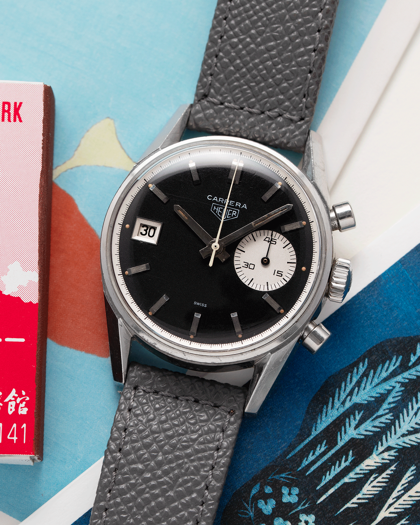 Brand: Heuer Year: 1960’s Model: Carrera Reference Number: Dato 45 Ref. 3147N Material: Stainless Steel Movement: Landeron 189 Case Diameter: 35mm Lug Width: 18mm Bracelet/Strap: A Collected Man Grey Textured Calf Strap