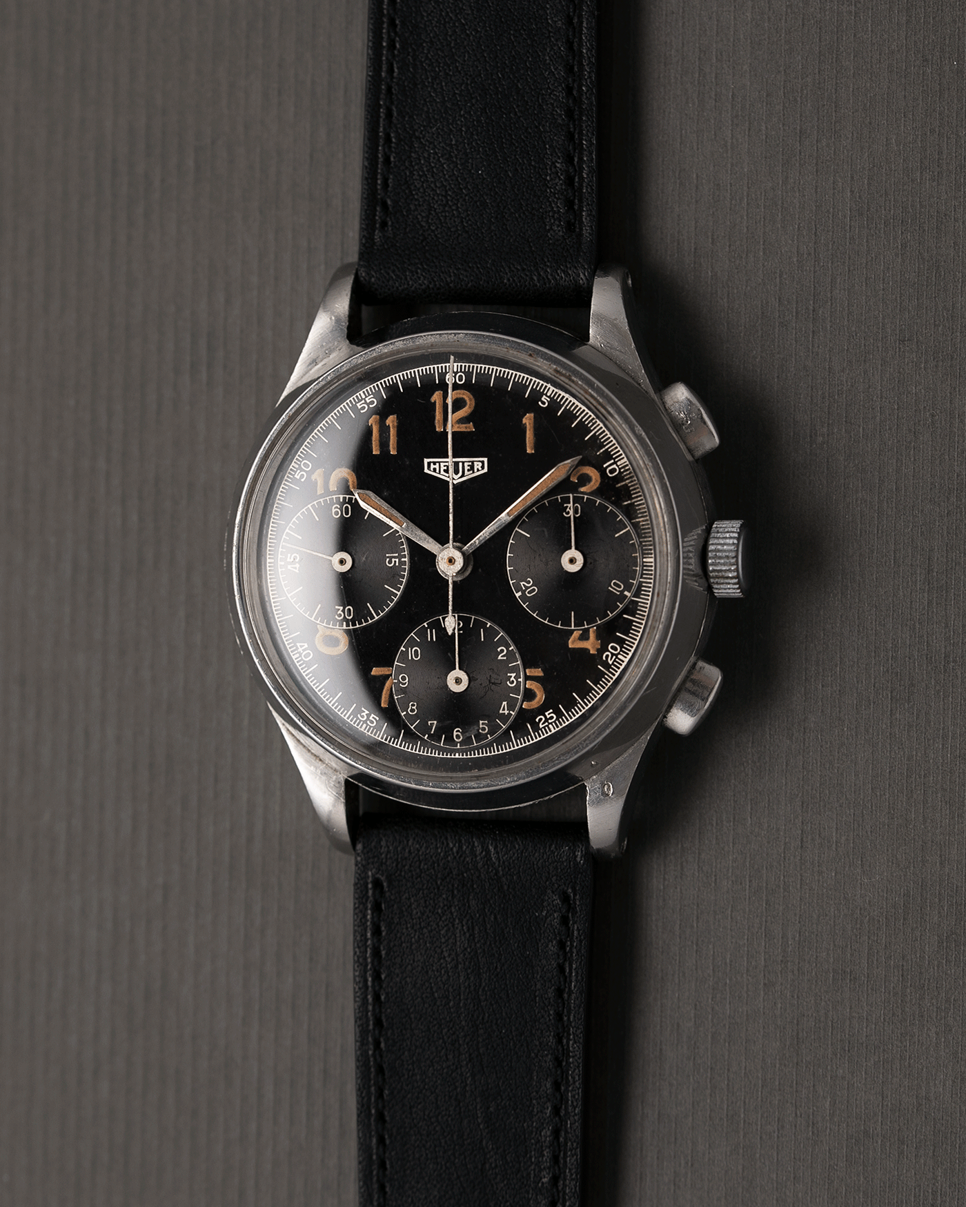 Brand: Heuer Year: 1940’s Reference Number: 345 Material: Stainless Steel Movement: Valjoux 71 Case Diameter: 36mm Lug Width: 18mm Bracelet/Strap: Nostime Black Calf Brand: Heuer Year: 1940’s Reference Number: 345 Material: Stainless Steel Movement: Valjoux 71 Case Diameter: 36mm Lug Width: 18mm Bracelet/Strap: Nostime Black Calf