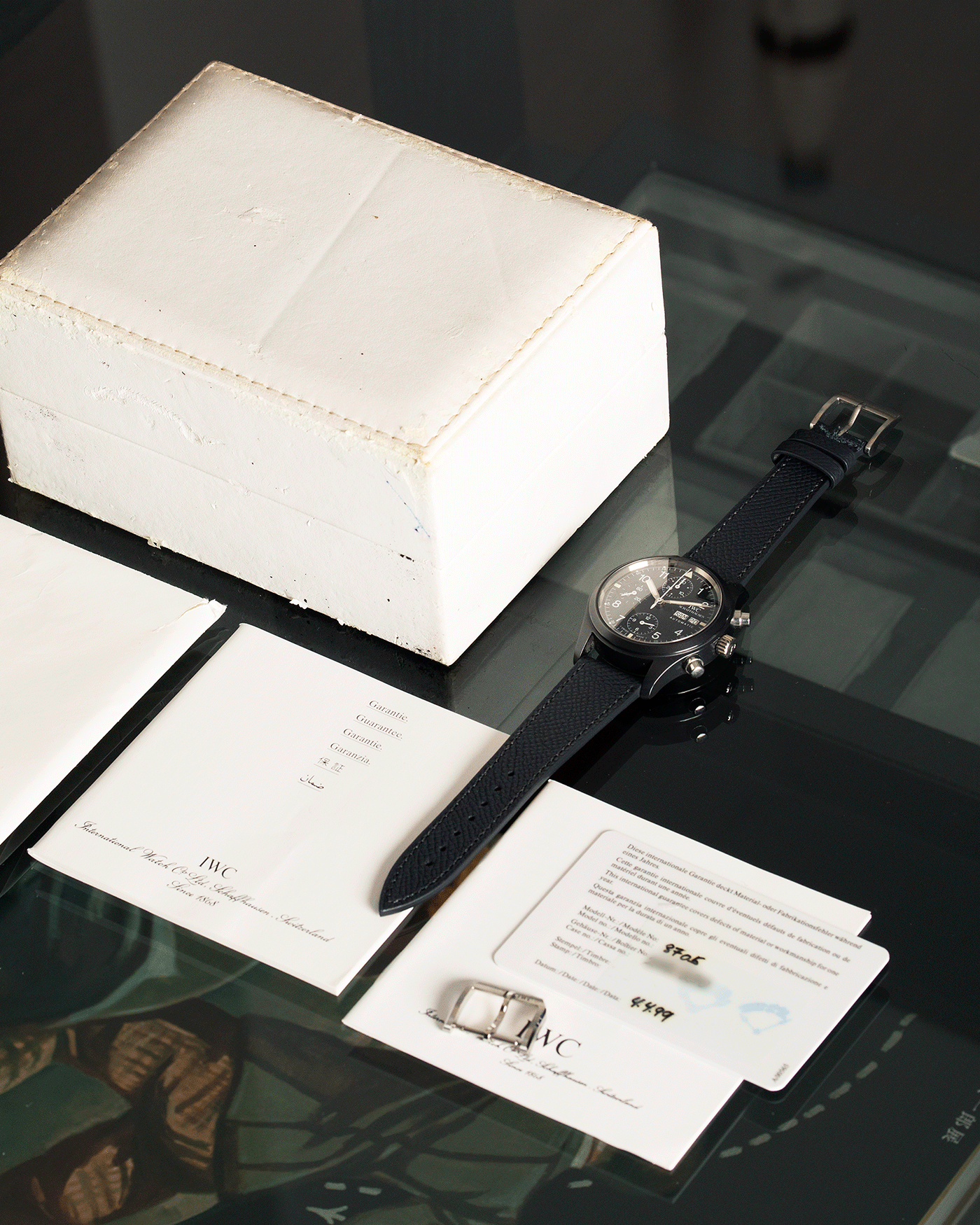 Brand: IWC Year: 1990s Model: Ceramic Fliegerchronograph Reference Number: 3705 Material: Ceramic and Stainless Steel Movement: Valjoux cal. 7750 Case Diameter: 39mm Bracelet/Strap: Molequin Anthracite Grained Calf with Stainless Steel IWC Tang Buckle