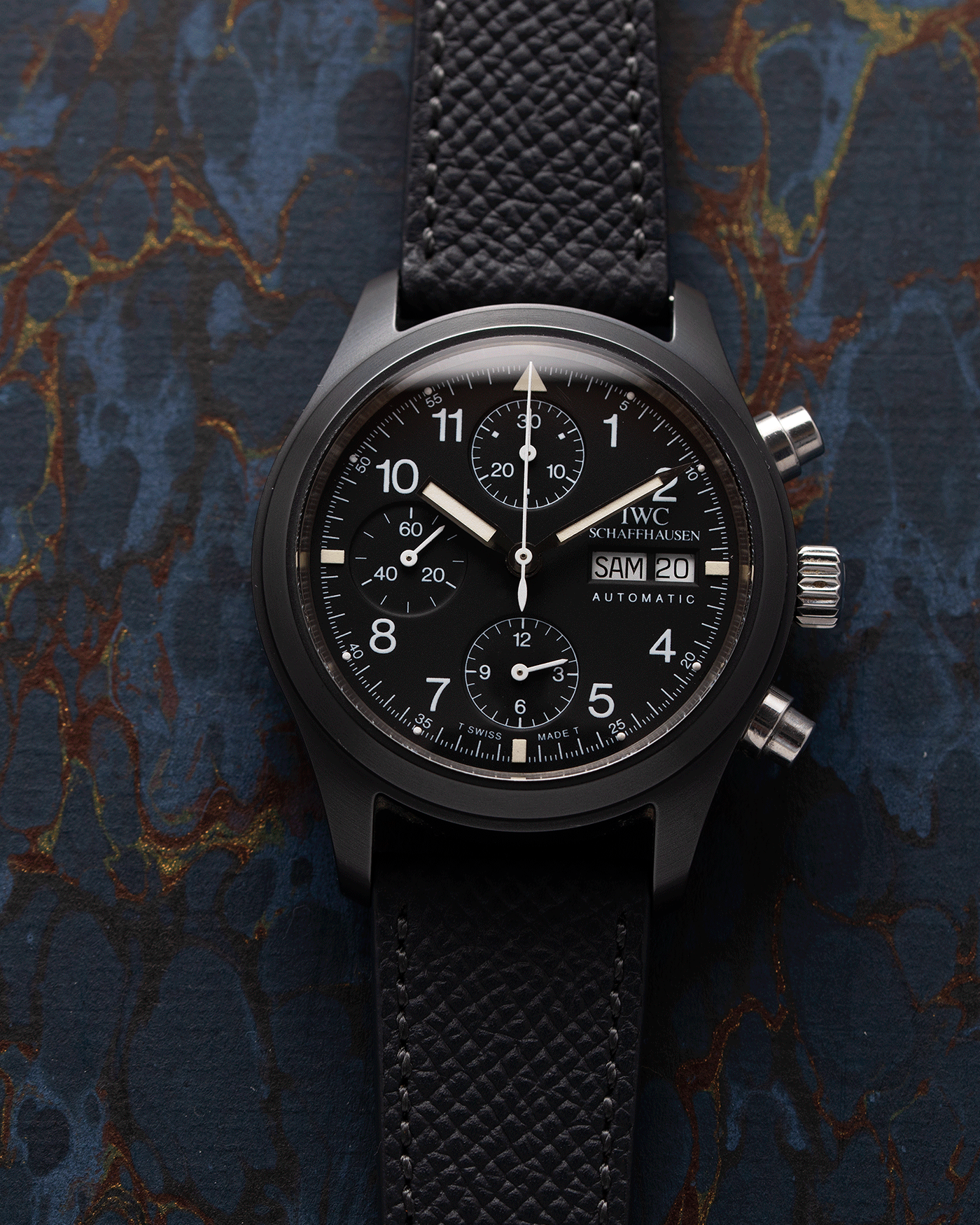 Brand: IWC Year: 1990s Model: Ceramic Fliegerchronograph Reference Number: 3705 Material: Ceramic and Stainless Steel Movement: Valjoux cal. 7750 Case Diameter: 39mm Bracelet/Strap: Molequin Anthracite Grained Calf with Stainless Steel IWC Tang Buckle