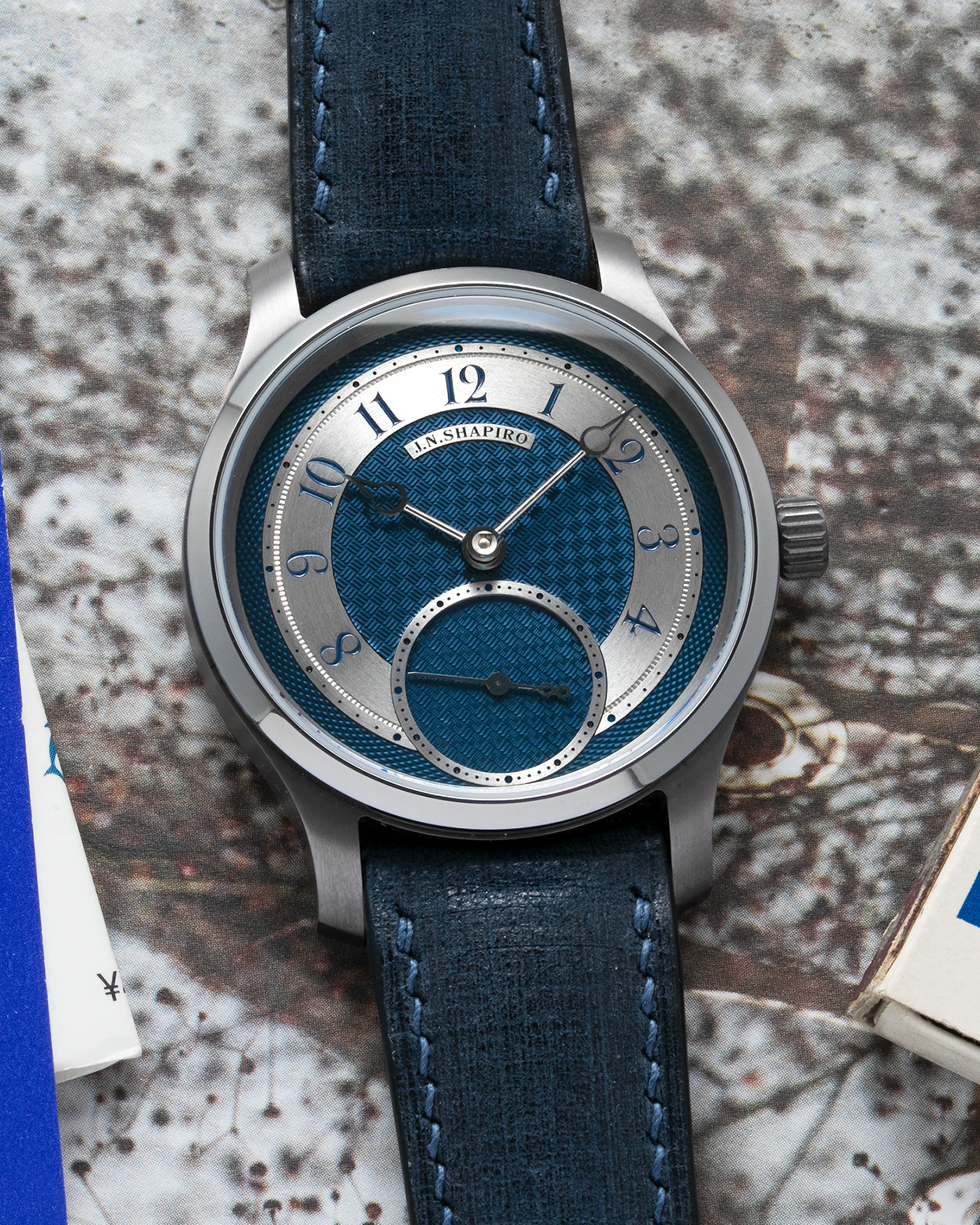 Brand: J.N. Shapiro Year: 2021 Model: Infinity Tantalum  Material: Tantalum Movement: UWD Cal. 33.1, Manual-Winding Case Diameter: 39mm Bracelet/Strap: J.N. Shapiro by Delugs Navy Blue Leather Strap with Signed Tantalum Tang Buckle with additional J.N. Shapiro Blue Alligator Strap and Grey Suede Strap