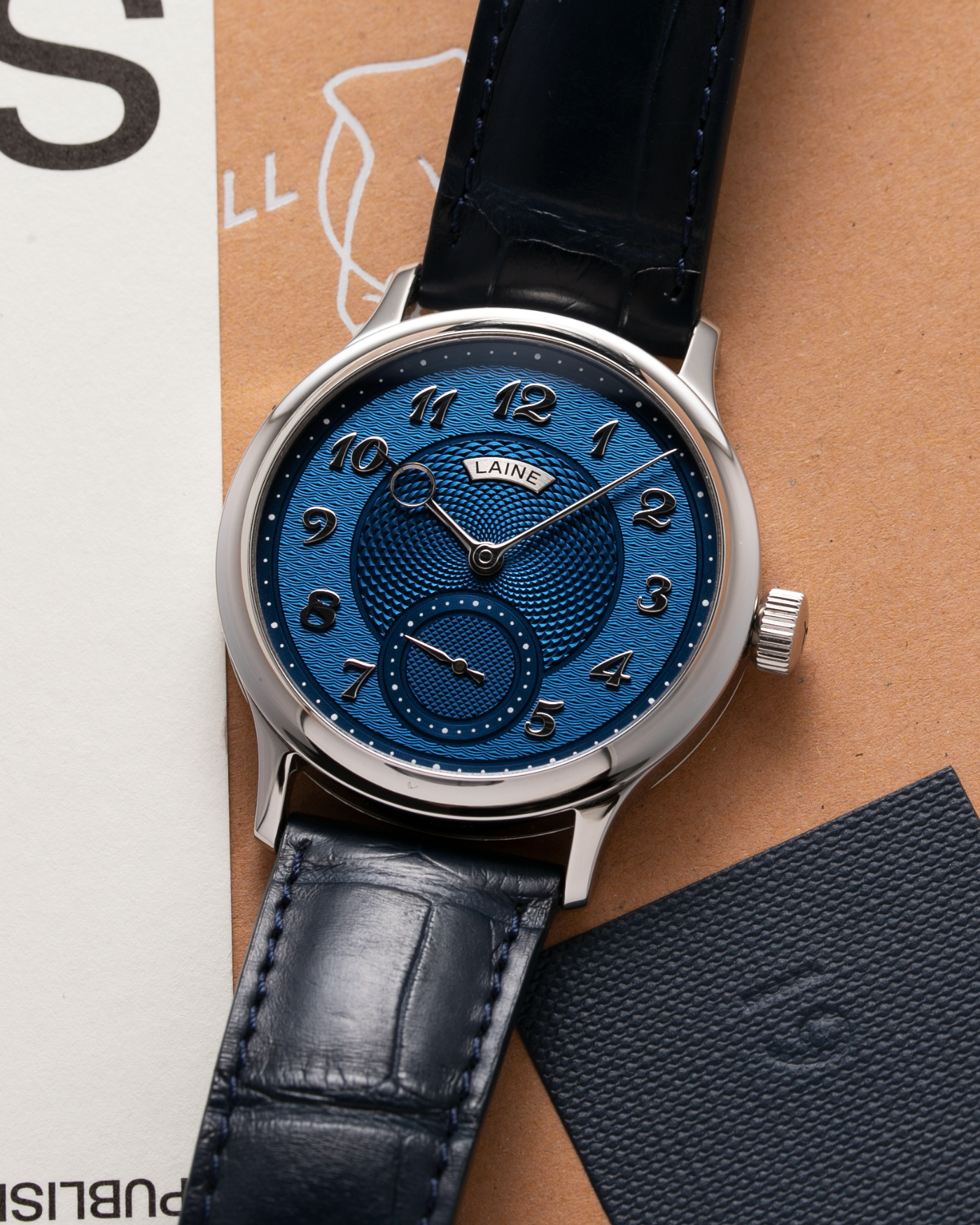 Brand: Laine Year: 2021 Model: V38 Material: Stainless Steel Movement: Vaucher VMF 5401  Case Diameter: 38mm Strap: Dark Blue Laine Alligator Strap and Signed Stainless Steel Tang Buckle
