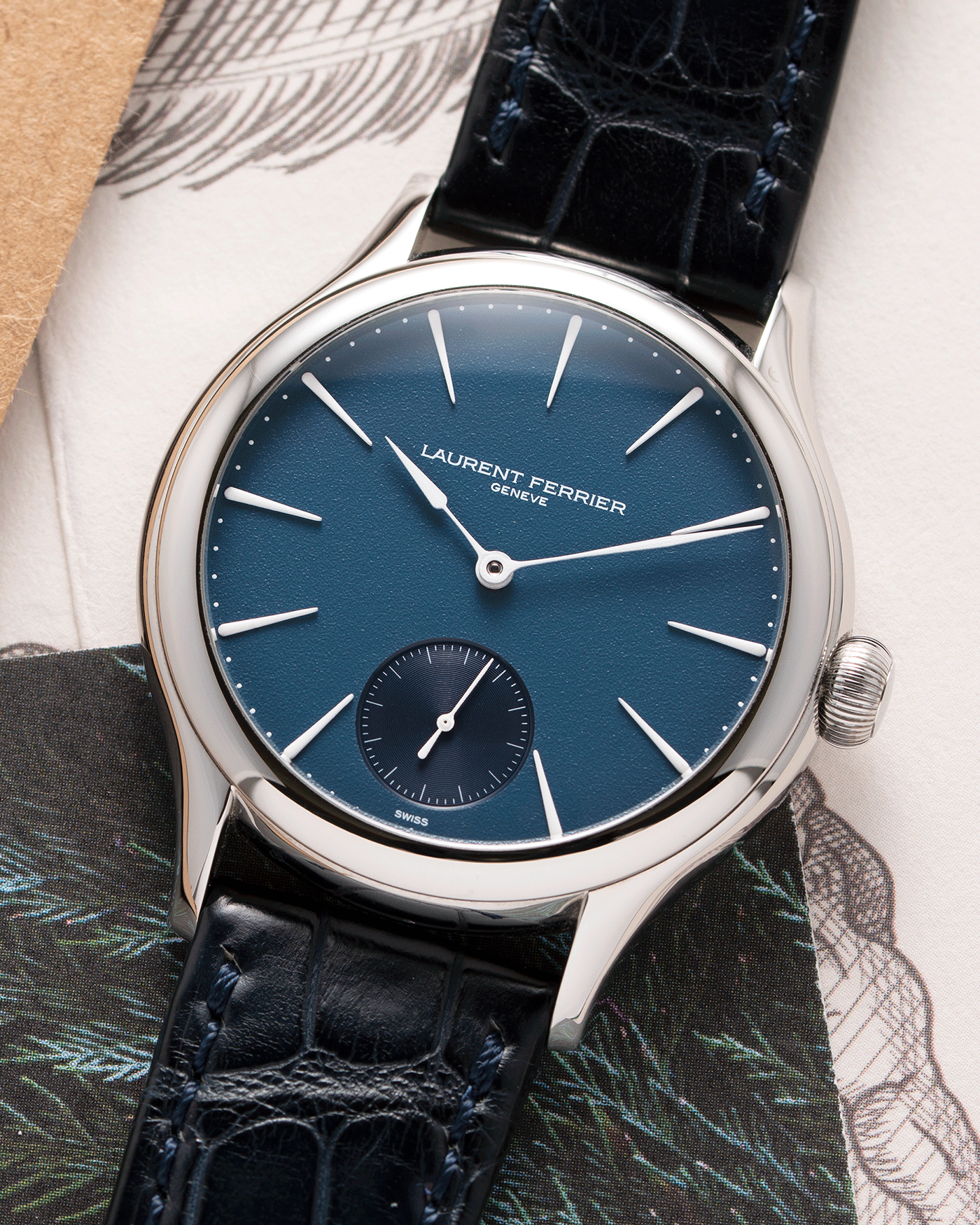 Brand: Laurent Ferrier Year: 2020 Model: Galet Classic Antoine de Macedo Material: Stainless Steel Movement: Cal. 229.01 Micro Rotor Case Diameter: 40mm Bracelet/Strap: Laurent Ferrier Blue Alligator Leather Strap with Laurent Ferrier Stainless Steel Tang Buckle
