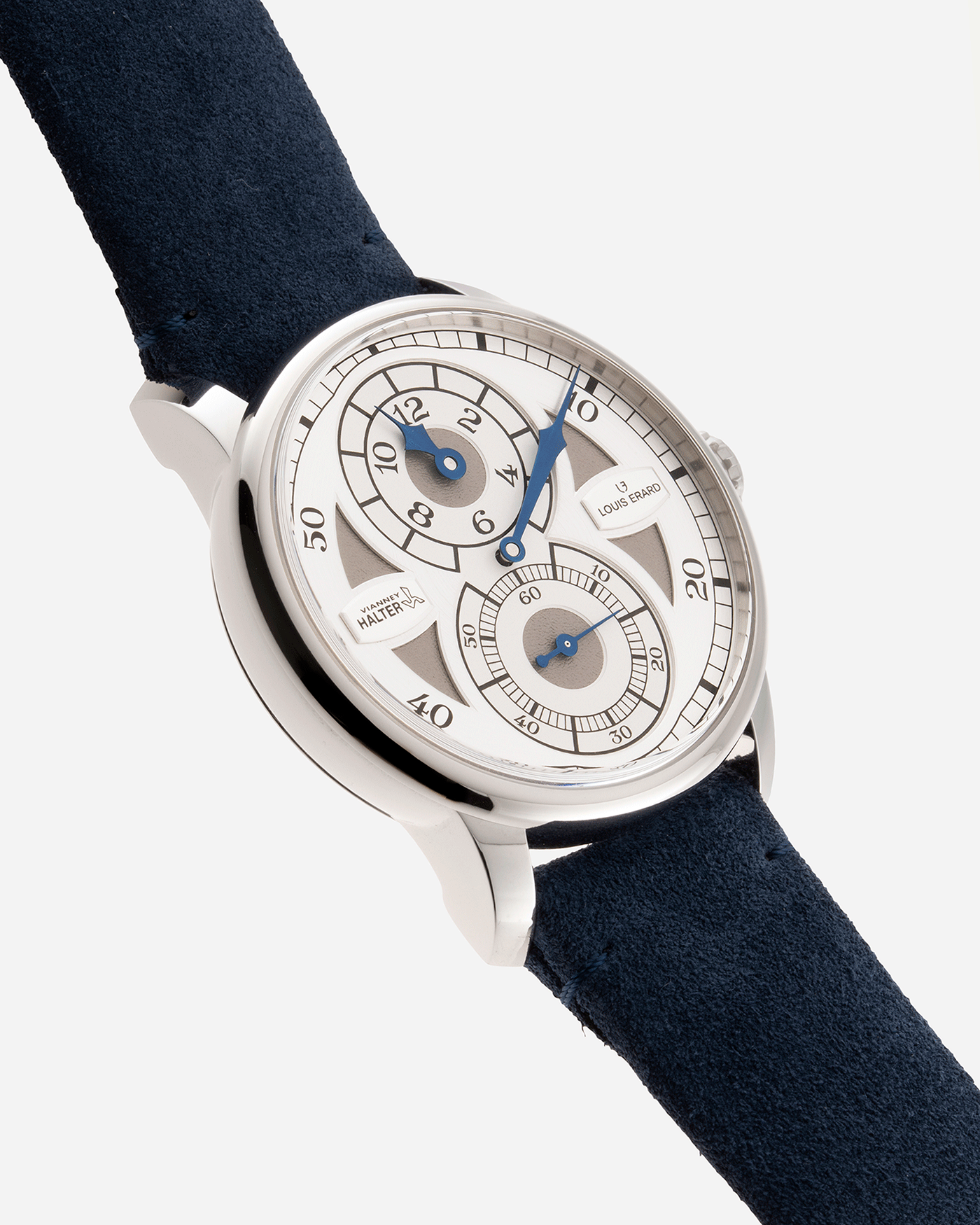 Brand: Louis Erard X Vianney Halter Year: 2020 Model: Le Regulateur Material: Stainless Steel Movement: Selitta Based Self Winding Movement Case Diameter: 42mm Bracelet/Strap: Louis Erard Blue Suede Strap with Stainless Steel Tang Buckle