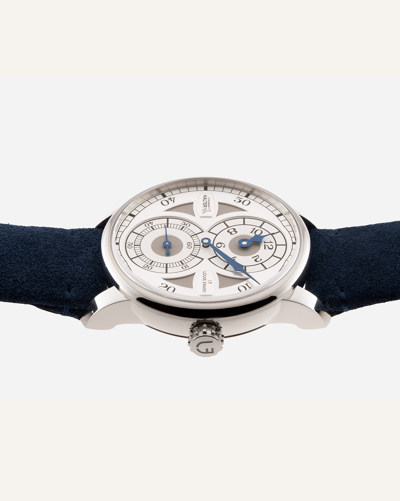 Brand: Louis Erard X Vianney Halter Year: 2020 Model: Le Regulateur Material: Stainless Steel Movement: Selitta Based Self Winding Movement Case Diameter: 42mm Bracelet/Strap: Louis Erard Blue Suede Strap with Stainless Steel Tang Buckle