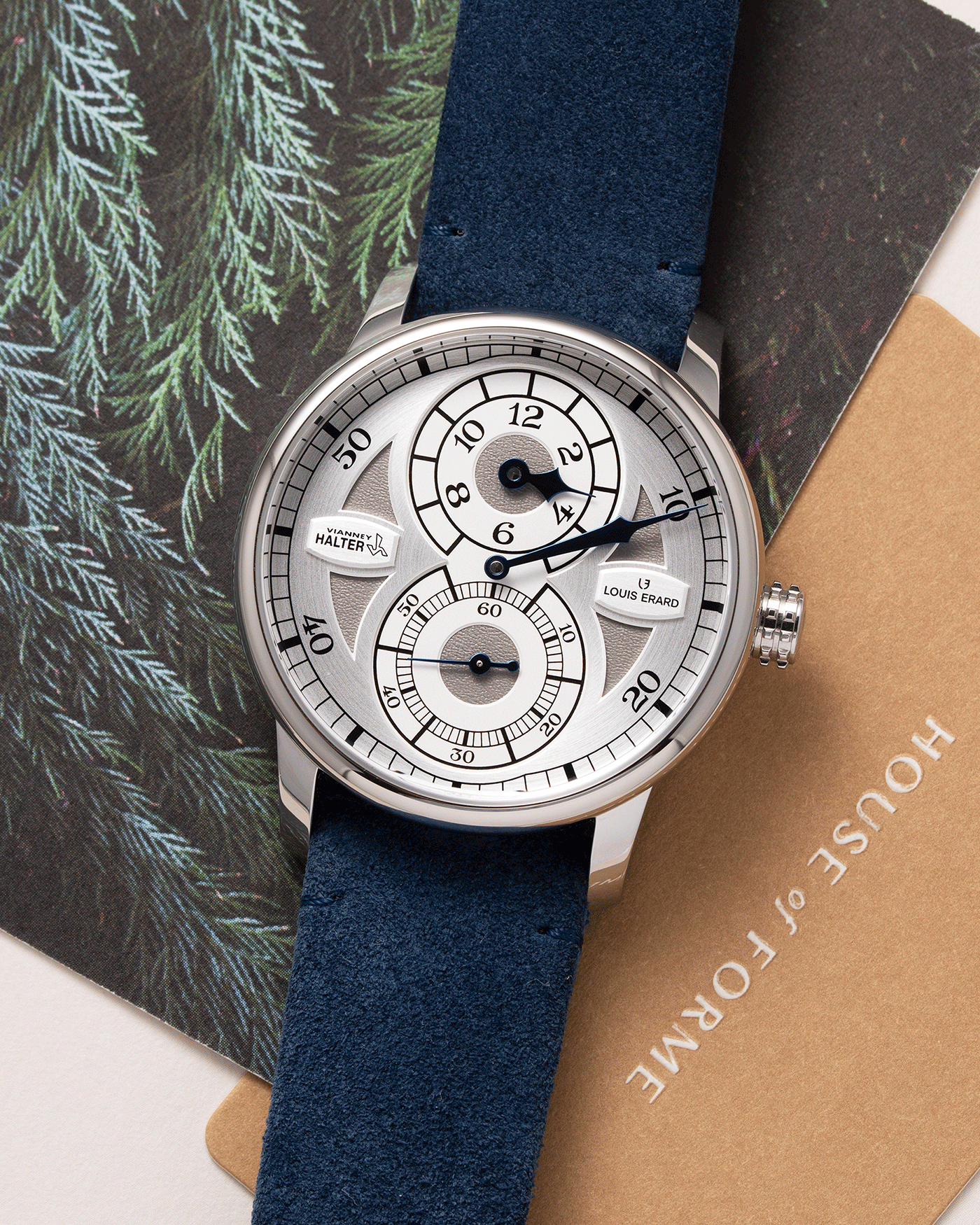 Brand: Louis Erard X Vianney Halter Year: 2020 Model: Le Regulateur Material: Stainless Steel Movement: Selitta Based Self Winding Movement Case Diameter: 42mm Bracelet/Strap: Louis Erard Blue Suede Strap with Stainless Steel Tang Buckle