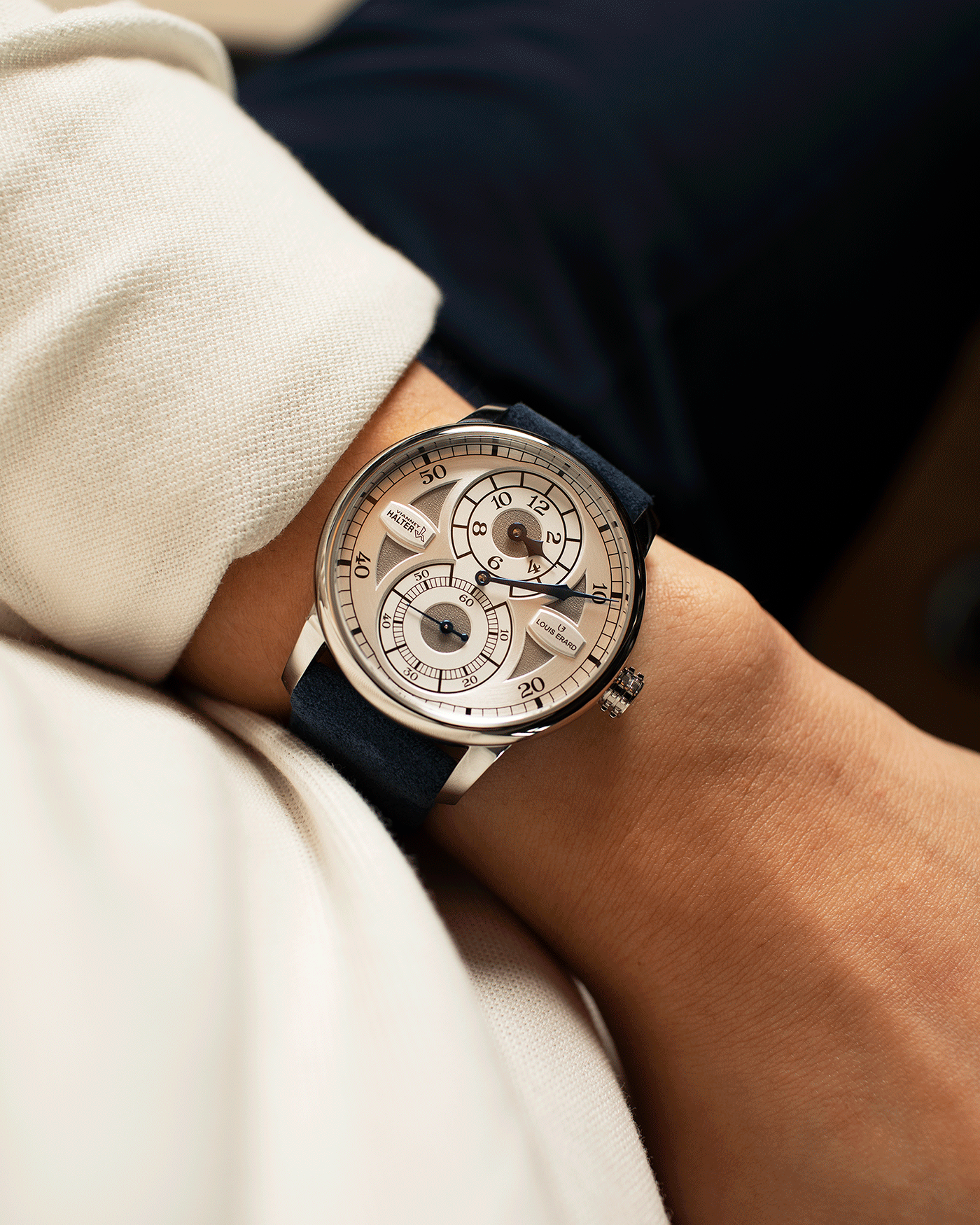 Brand: Louis Erard X Vianney Halter Year: 2020 Model: Le Regulateur Material: Stainless Steel Movement: Selitta Based Self Winding Movement Case Diameter: 42mm Bracelet/Strap: Louis Erard Blue Suede Strap with Stainless Steel Tang Buckle
