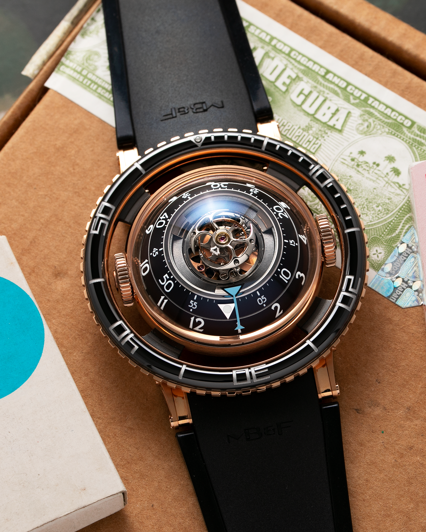 Brand: MB&F Year: 2022 Model: HM7 Aquapod Material: 18k Rose Gold Movement: In-House 3D Vertical Architecture MB&F HM7 Tourbillon Case Diameter: 53.8mm X 21.3mm With Articulating Lugs Bracelet/Strap: MB&F Black Rubber Strap with 18k Rose Gold Deployant Clasp