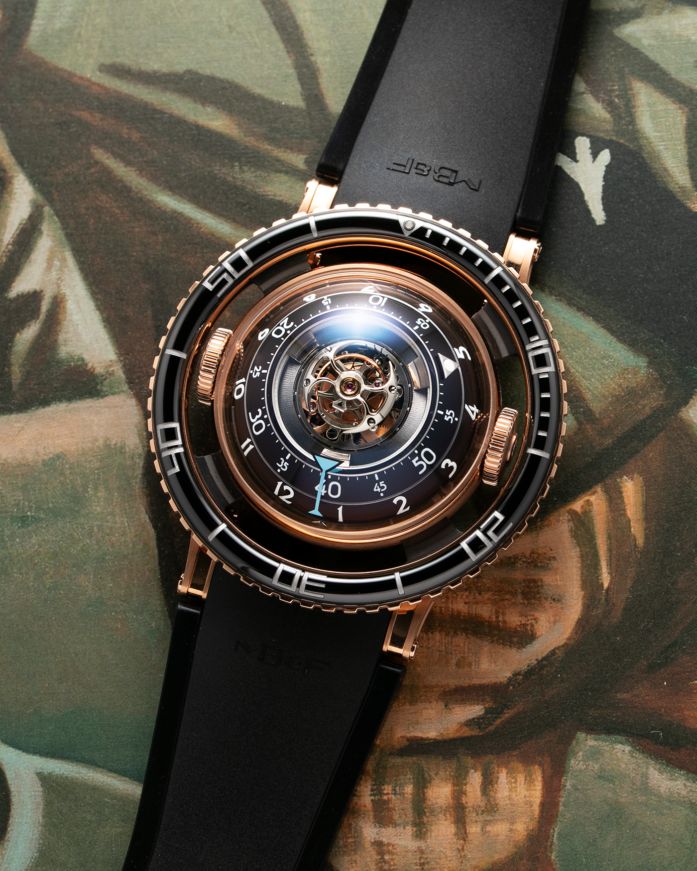 Brand: MB&F Year: 2022 Model: HM7 Aquapod Material: 18k Rose Gold Movement: In-House 3D Vertical Architecture MB&F HM7 Tourbillon Case Diameter: 53.8mm X 21.3mm With Articulating Lugs Bracelet/Strap: MB&F Black Rubber Strap with 18k Rose Gold Deployant Clasp