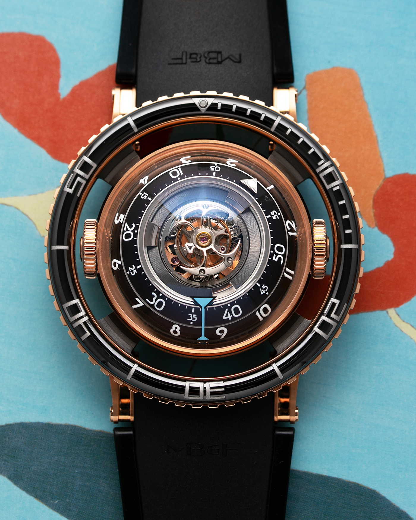 Brand: MB&F Year: 2022 Model: HM7 Aquapod Material: 18k Rose Gold Movement: In-House 3D Vertical Architecture MB&F HM7 Tourbillon Case Diameter: 53.8mm X 21.3mm With Articulating Lugs Bracelet/Strap: MB&F Black Rubber Strap with 18k Rose Gold Deployant Clasp