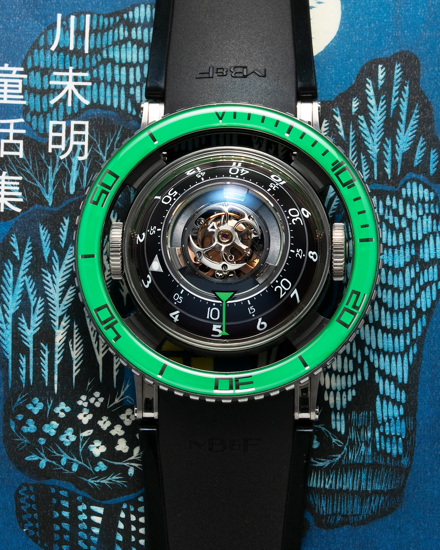 Brand: MB&F Year: 2021 Model: HM7 Aquapod Material: Grade 5 Titanium Movement: In-House 3D Vertical Architecture MB&F HM7 Tourbillon, Self-Winding Case Diameter: 53.8mm X 21.3mm With Articulating Lugs Bracelet/Strap: MB&F Black Rubber Strap with Grade 5 Titanium Deployant Clasp